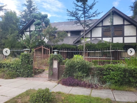 Seen from a closer angle, the gated entrance draws the eye toward the home where the fatal confrontation between Marvin Jr. and his father unfolded. The rust-colored gate sits between brick pillars as climbing vines, hedges, and dense garden plants surround the pathway, partially concealing the lower portion of the house while its sharply pitched gables dominate the view above. | Source: Instagram/stephanosmoothlewis