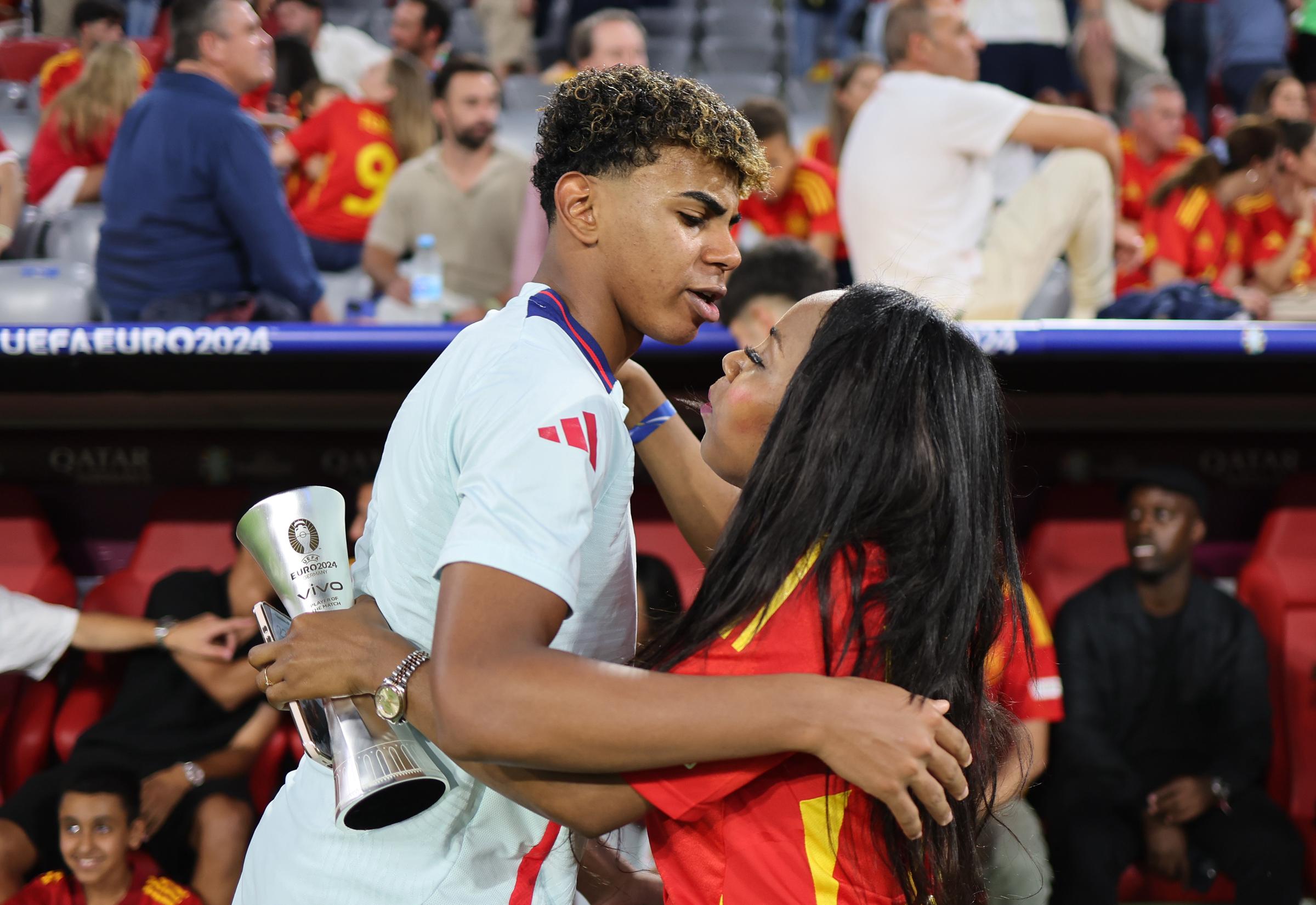Lamine Yamal embraces his mother, Sheila Ebana, after the UEFA EURO 2024 semifinal match between Spain and France at Munich Football Arena on July 9 in Germany. | Source: Getty Images