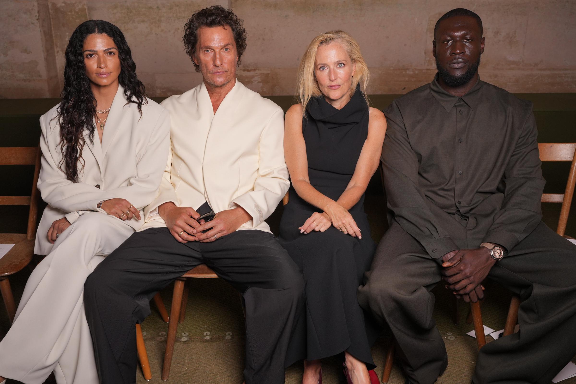 In another photo taken during the event, Emma Roberts is noticeably absent, with Stormzy seated next to Gillian Anderson instead. The image features Alves, McConaughey, Anderson, and Stormzy seated in a row. Roberts may not have arrived yet or may have stepped away before the photo was taken.