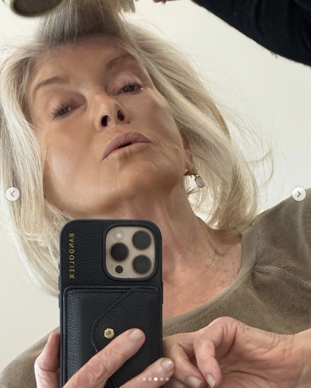 Martha Stewart holding up her mobile phone for a selfie, from a carousel post in January 2026 | Source: instagram/marthastewart