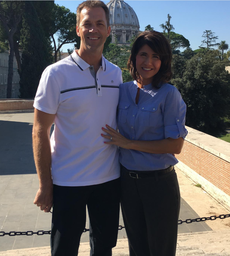 In a sunlit courtyard, Kristi rests a hand against Bryon’s chest—simple, steady, and reflective of a long familiarity. | Source: Instagram/sdbryonnoem