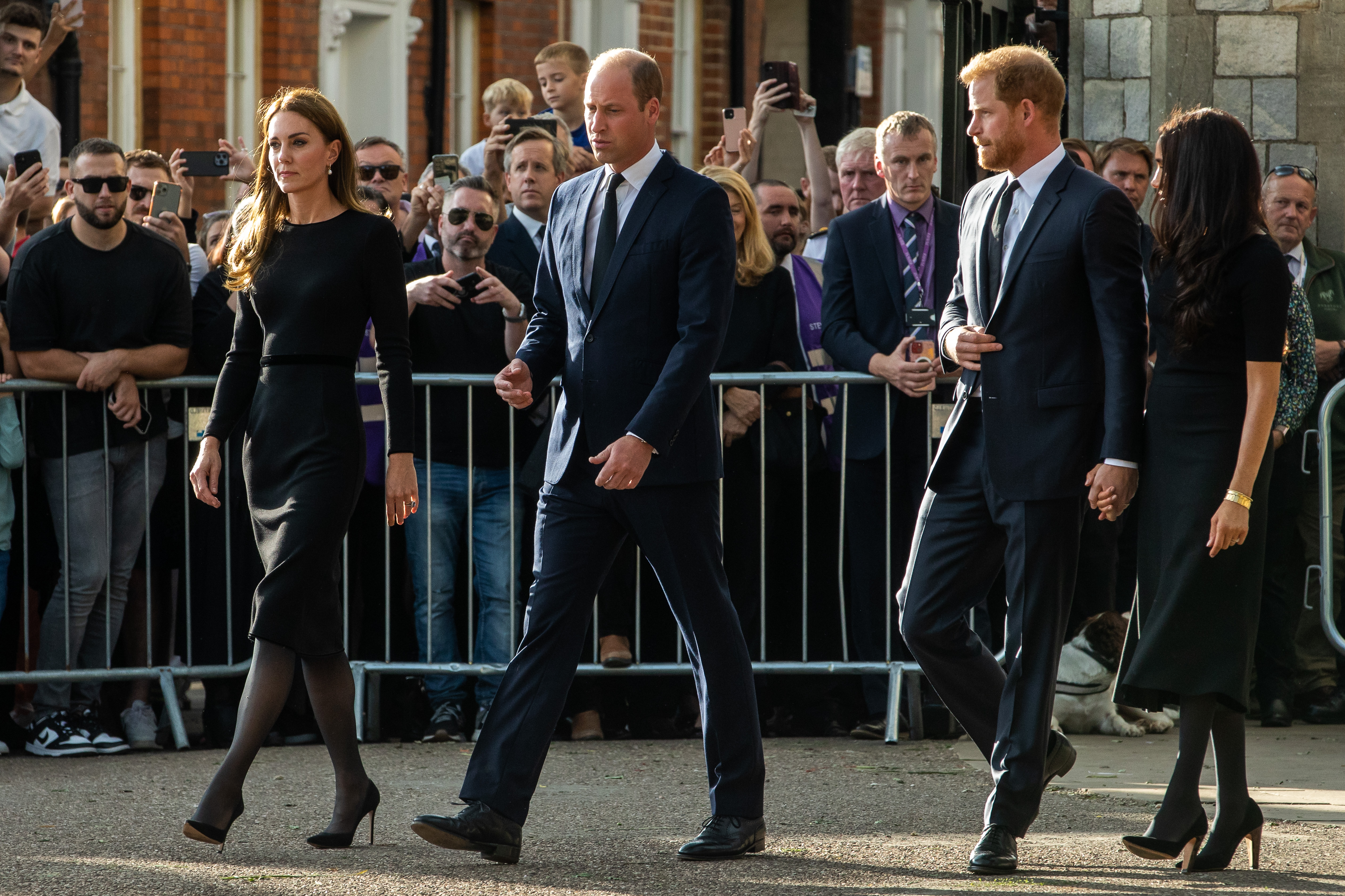 Prince William and Catherine, the new Prince and Princess of Wales, accompanied by Prince Harry and Meghan, the Duke and Duchess of Sussex, greet well-wishers outside Windsor Castle on September 10, 2022, in Windsor, United Kingdom | Source: Getty Images