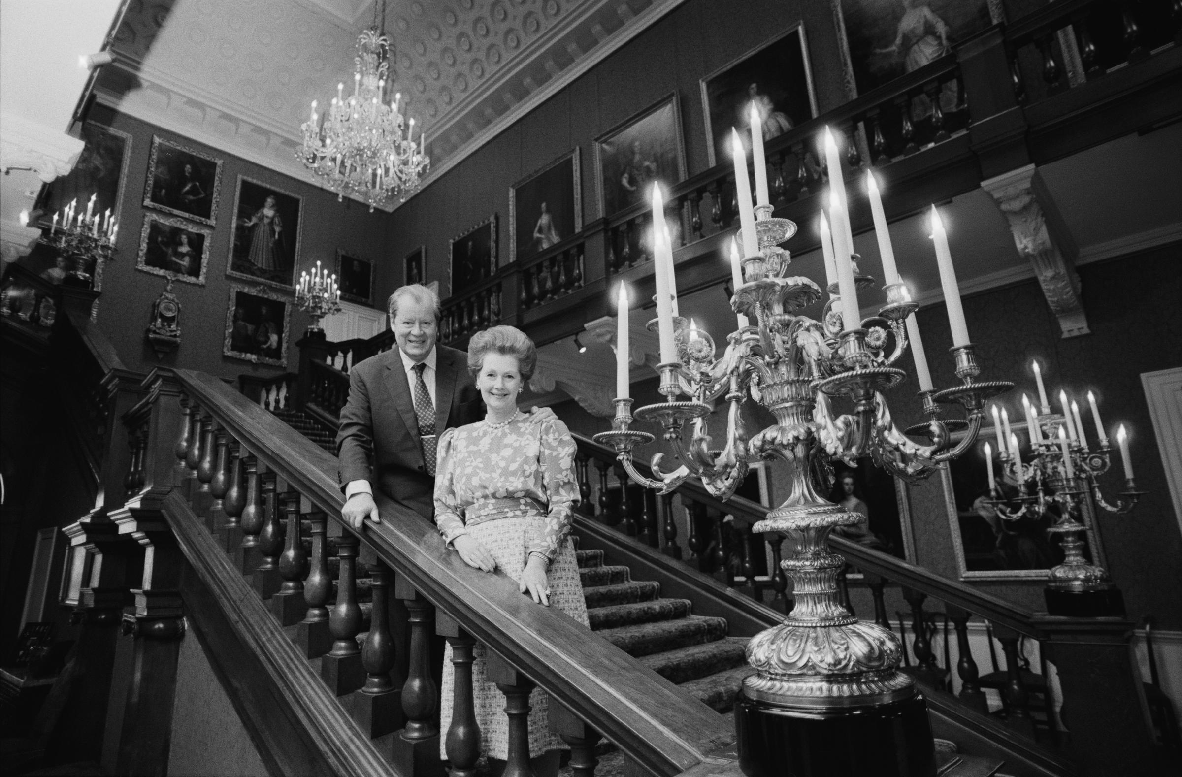 The late John Spencer, 8th Earl Spencer, with the late Raine, Countess Spencer at Althorp in Northamptonshire in December 1986. | Source: Getty Images