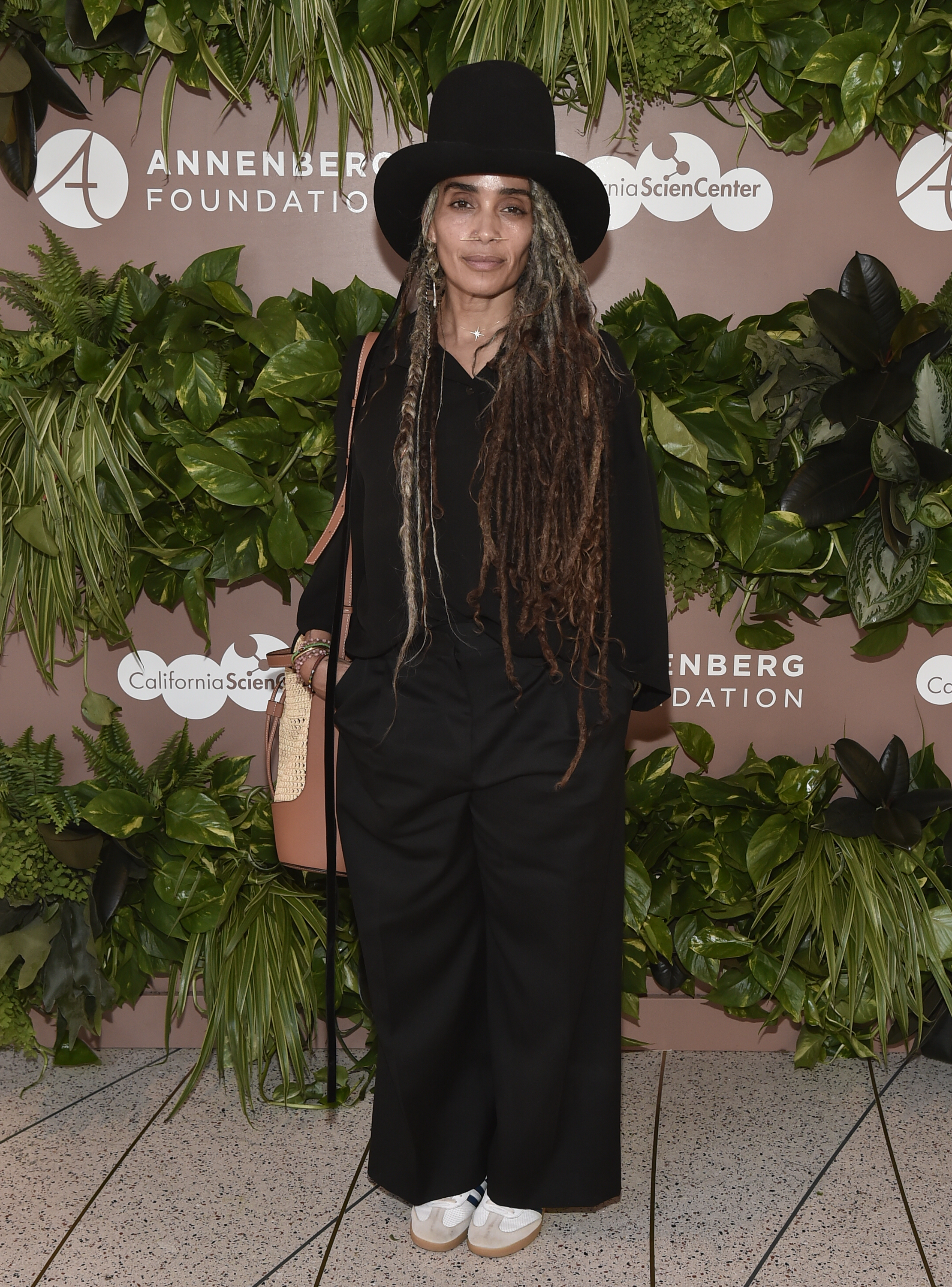 This 2022 photo shows Lisa Bonet during one of her last public outings before her four-year absence from major events. She attended the North American premiere of Sebastião Salgado's Amazônia exhibition in Los Angeles, wearing her long locs under a wide-brimmed black hat. | Source: Getty Images