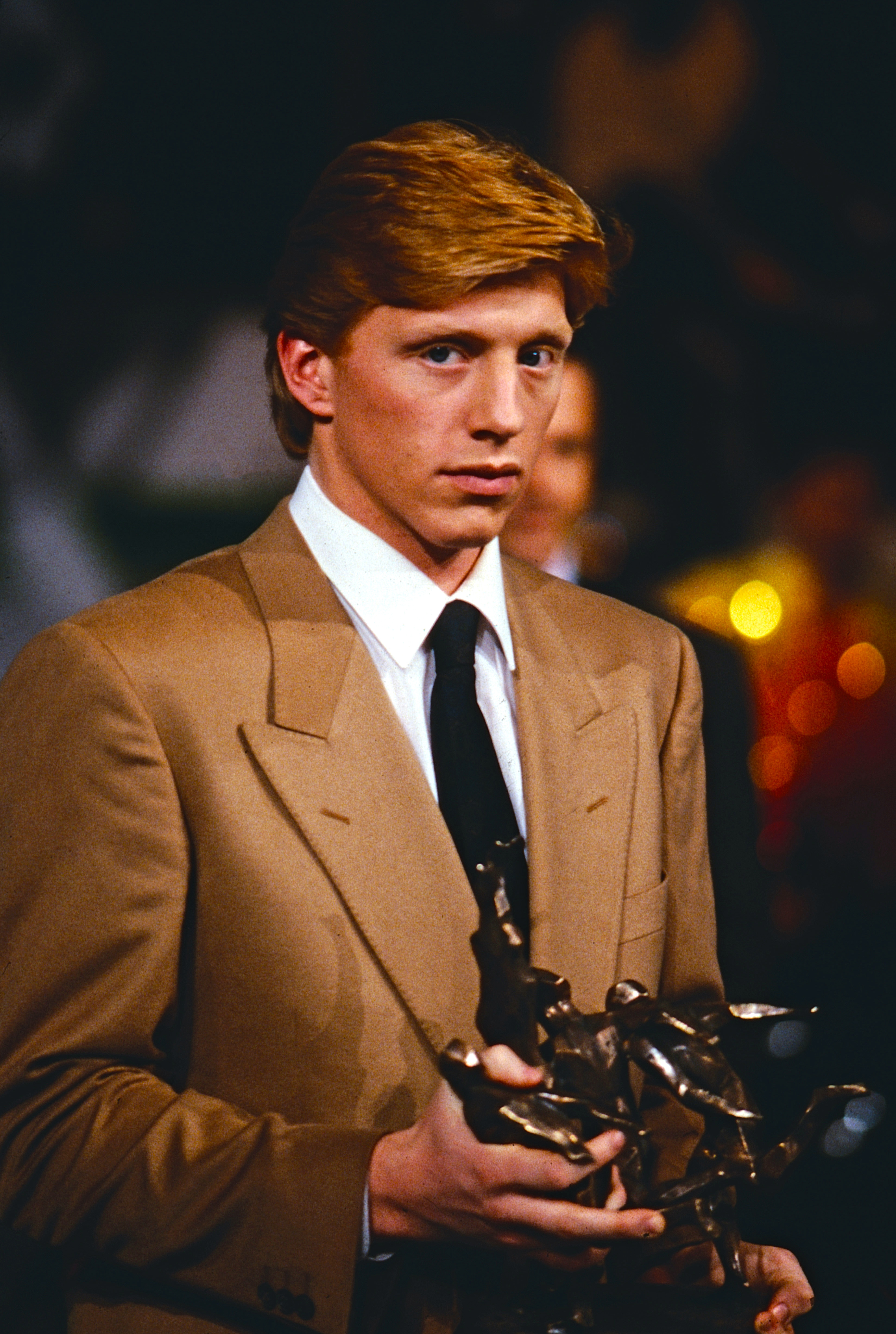 Boris Becker held his trophy after being named Germany's Sportsman of the Year in 1985, capping a breakthrough season that had turned the teenager into an international tennis star. His historic Wimbledon victory was the defining achievement of that year, but Boris later reflected that finding such extraordinary success at 17 brought pressures he felt were difficult to manage at such a young age.