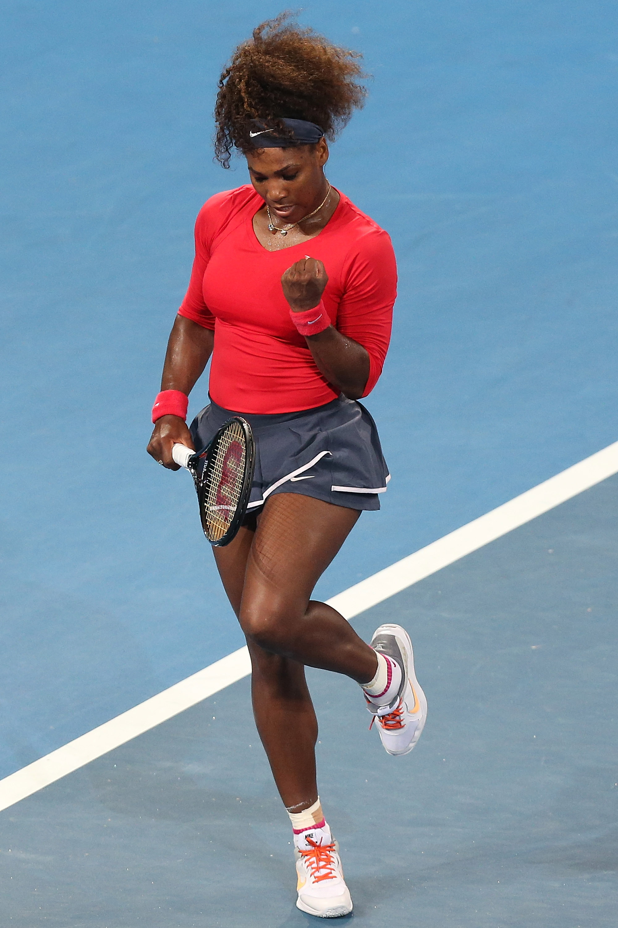 Back in her element, Serena Williams leaps in joy as she celebrates winning a point against Alize Cornet of France on day three of the Brisbane International at Pat Rafter Arena in Brisbane, Australia.