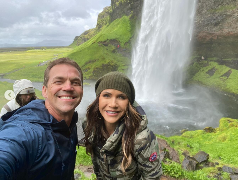 Bundled up beside a rushing waterfall, Kristi and Bryon lean in for a windswept selfie—adventure, laughter, and the kind of shared experience that turns into lasting memory. | Source: Instagram/sdbryonnoem
