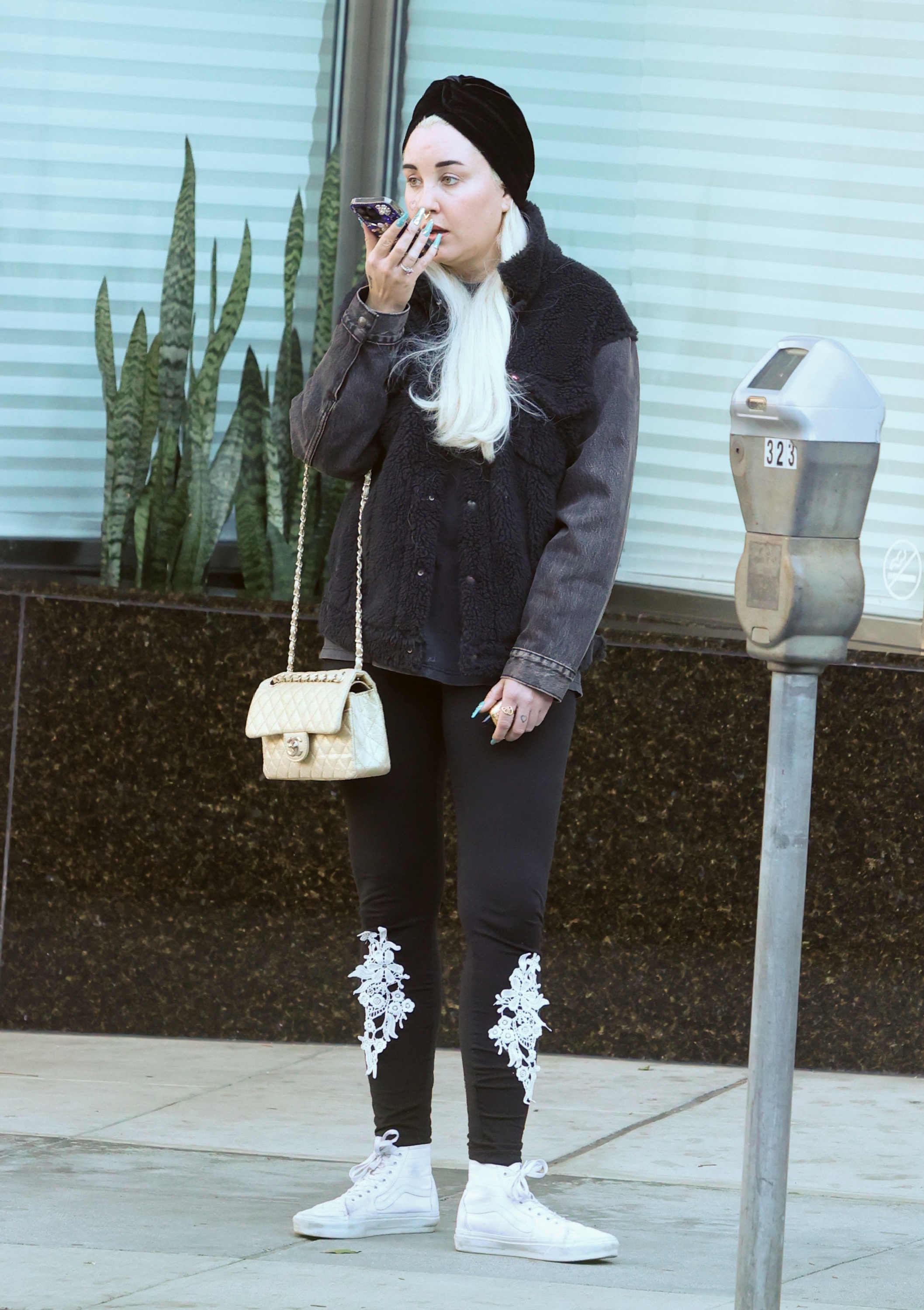 In another 2024 sighting, Bynes appeared in a more understated monochrome look, pairing platinum hair and a black headwrap with patterned leggings, sneakers, and a designer shoulder bag while out in Los Angeles.