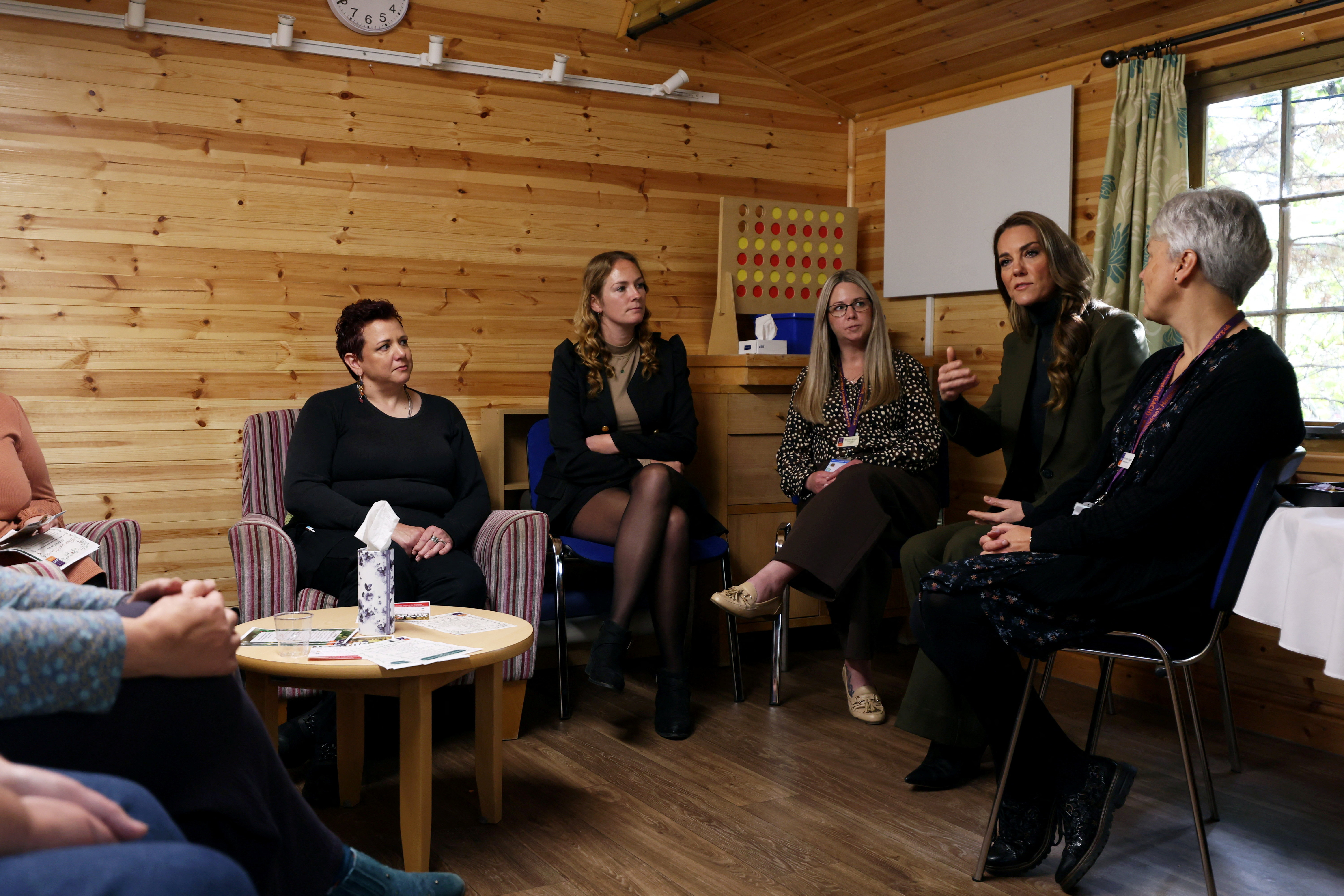 Princess Catherine sits down with families and staff at The Treehouse Children's Hospice in Ipswich. Her visit came as George's first extended autumn break from Eton College was about to begin. | Source: Getty Images