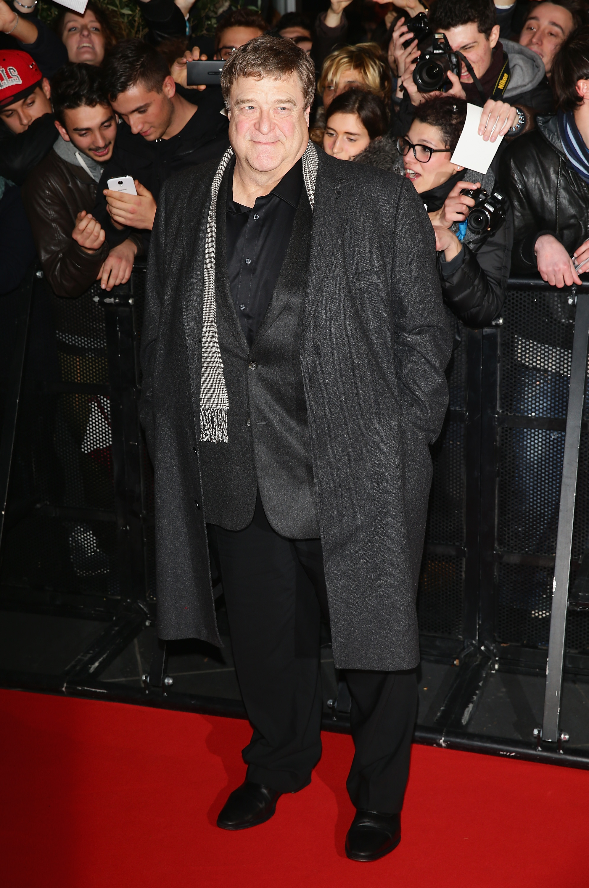 John Goodman attends The Monuments Men premiere on February 10, 2014, in Milan, Italy, years into the lifestyle changes that included cutting sugar and working out six days a week. | Source: Getty Images
