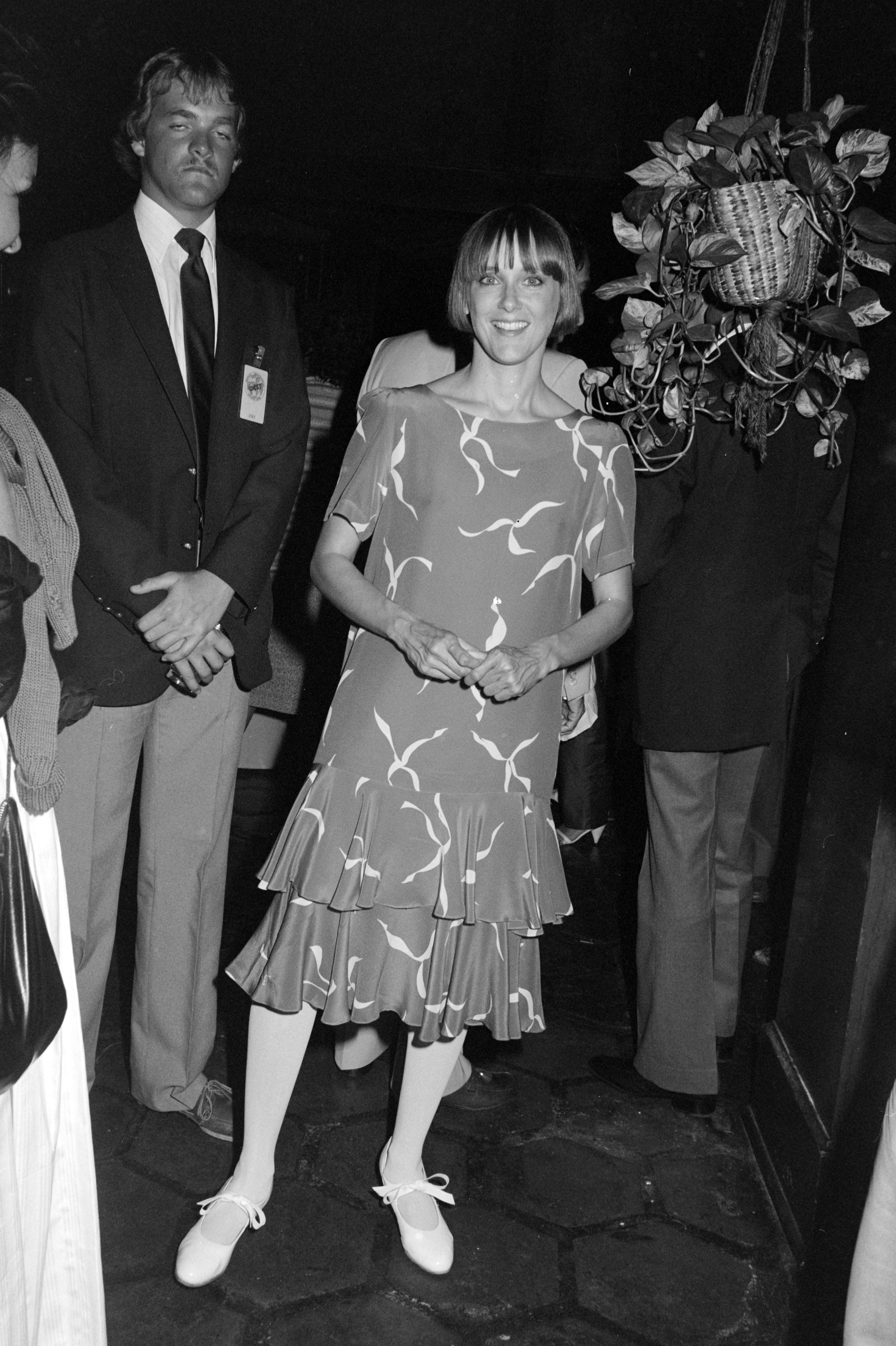 Mary Beth Hurt attends a Scott Newman Foundation benefit in Los Angeles in 1982, wearing a patterned dress with a flared hem and flats. Her relaxed pose and soft smile reflect her growing public presence at charity events in the early 1980s.