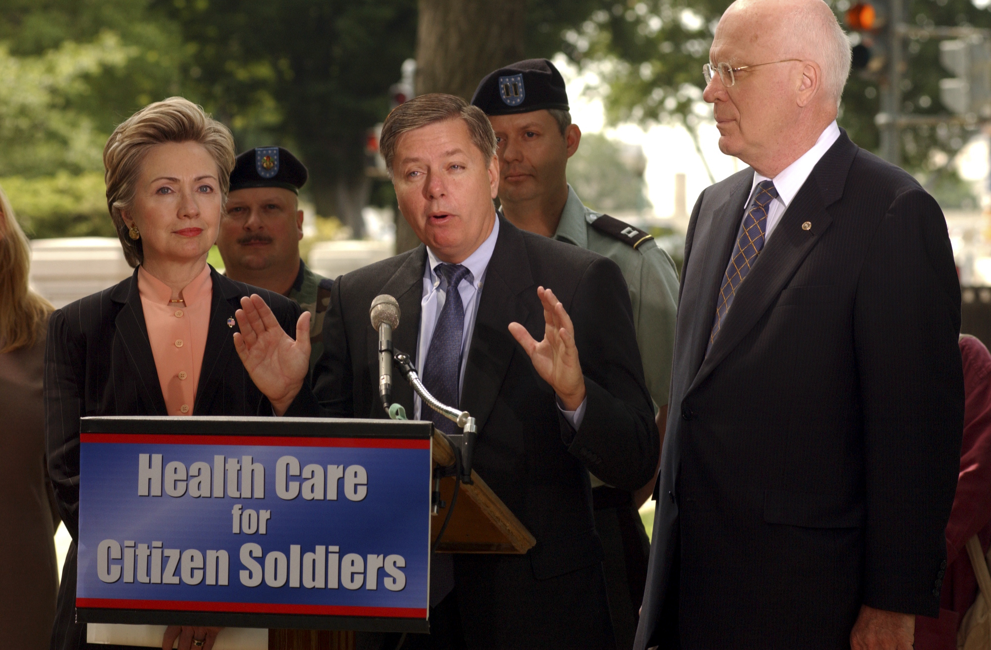 Standing alongside Sens. Hillary Clinton and Patrick Leahy, Lindsey Graham speaks during a bipartisan news conference focused on health care for National Guard and Reserve members. The event reflected his willingness to work across party lines on issues affecting military service members. | Source: Getty Images