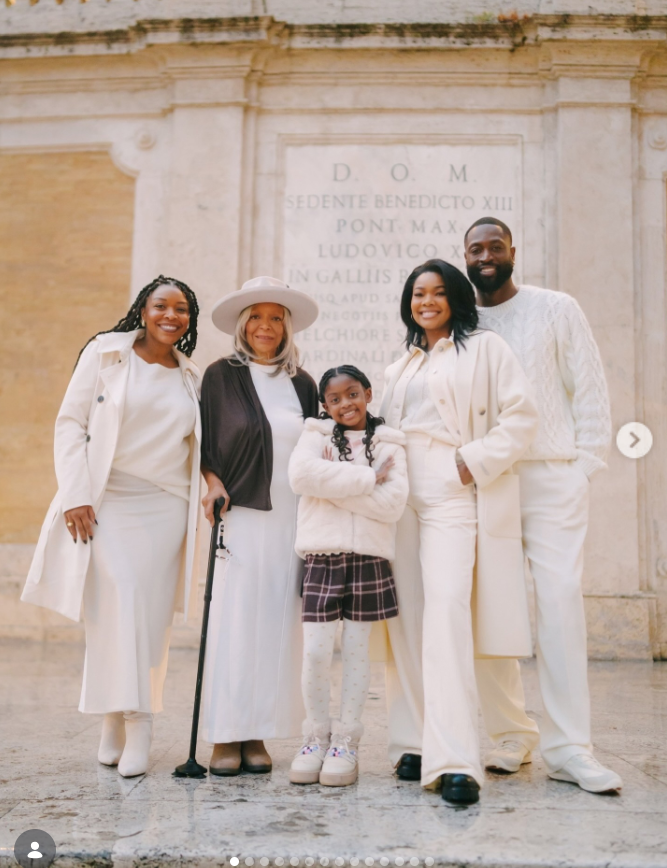 A multi-generational family portrait shows Gabrielle Union and Dwyane Wade standing with relatives, including an elderly woman holding a cane and a young girl at the center. | Source: Instagram/gabunion