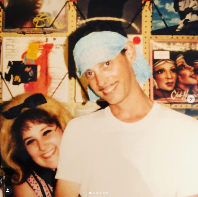 Ricki Lake got her big break landing the role of Tracy Turnblad in John Waters' "Hairspray." Here she is with the director in a TBT photo posted on April 22, 2026, for his birthday. | Source: Instagram/rickilake