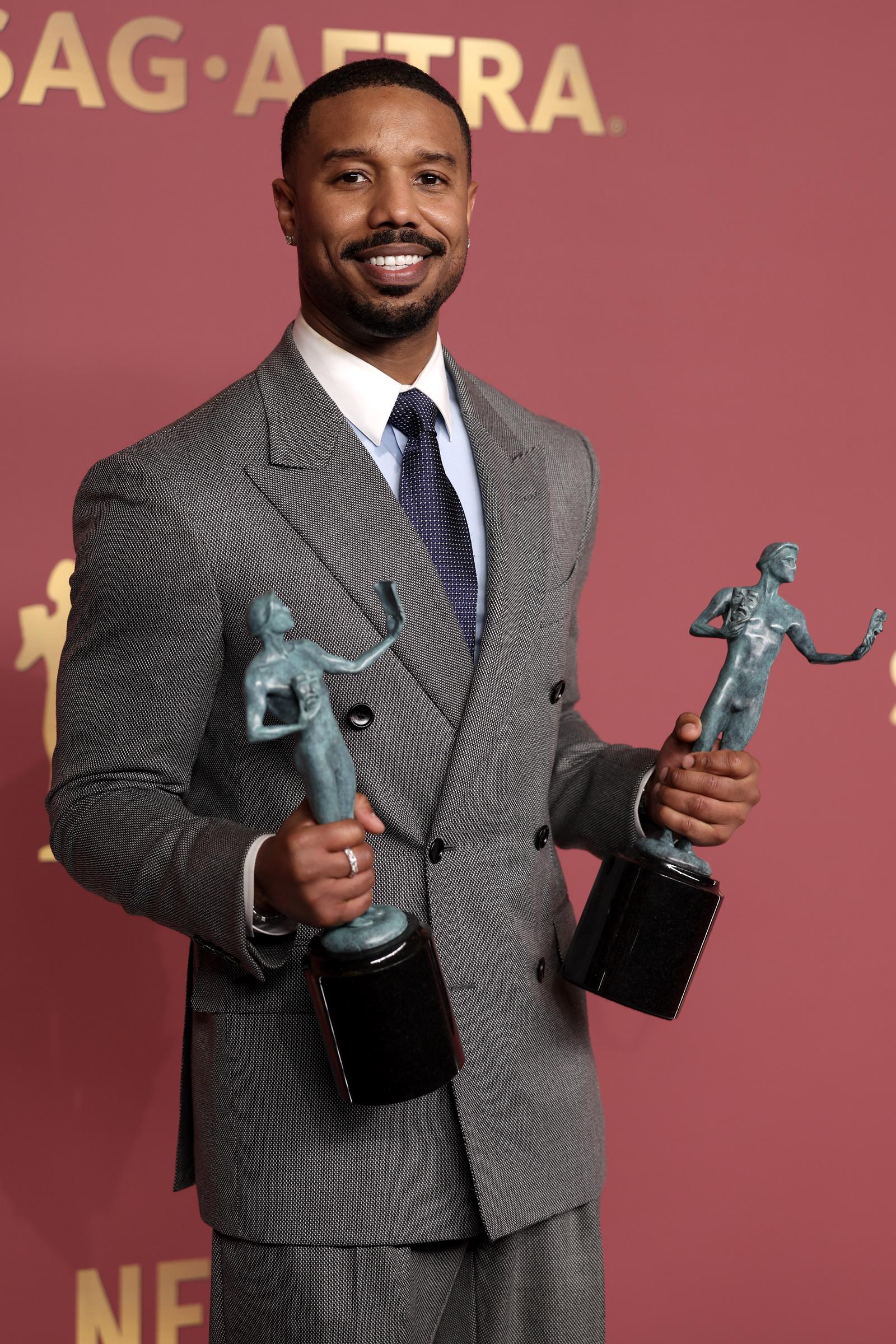 Michael B. Jordan holds his Actor Award for Outstanding Performance by a Male Actor | Source: Getty Images
