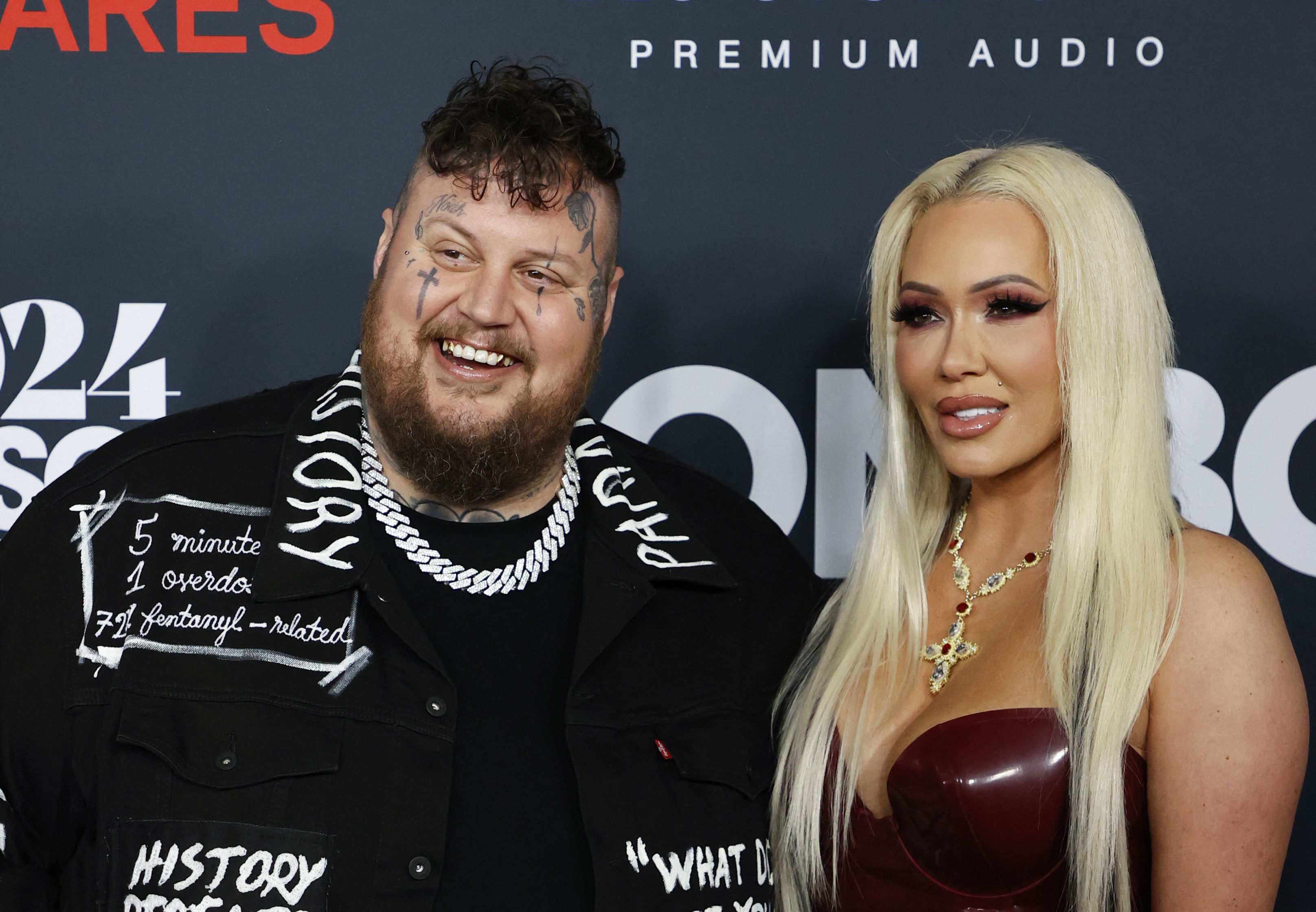 Jelly Roll and Bunnie Xo pose together at the 2024 MusiCares Person of the Year gala in Los Angeles. Recent reports indicate the former couple have begun dividing assets following their divorce filing, including properties that could form part of Jelly Roll's reported $20 million fortune. | Source: Getty Images