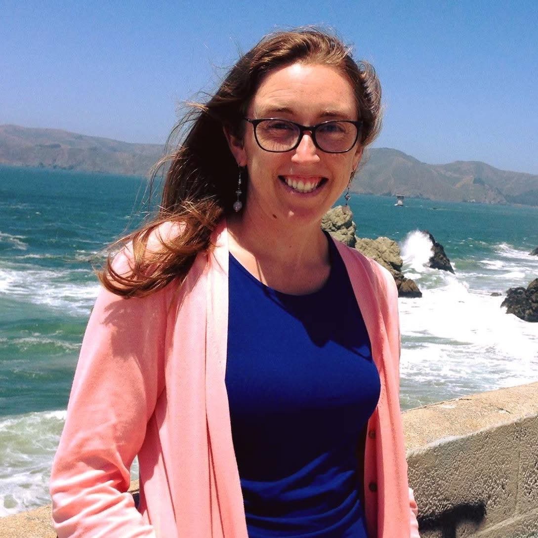 Dr. Julia Pederson beams against a breezy coastal backdrop, smiling with the wind in her hair beside the ocean waters she loved. While initial reports suggested the 41-year-old pediatrician had perished in an accidental bedroom fire, an autopsy conducted on October 13, 2026, revealed the devastating truth that she had been strangled and suffered multiple traumatic injuries before the blaze was intentionally set, leading authorities to rule her death a homicide. | Source: GoFundMe