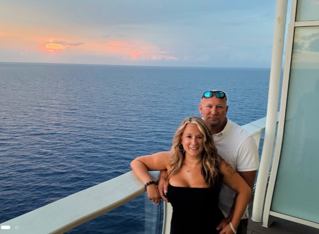 Standing side by side on a balcony overlooking the endless ocean, Rachel and Jeremy Tussey lean into each other as the sun dips below the horizon. | Source: GoFundMe
