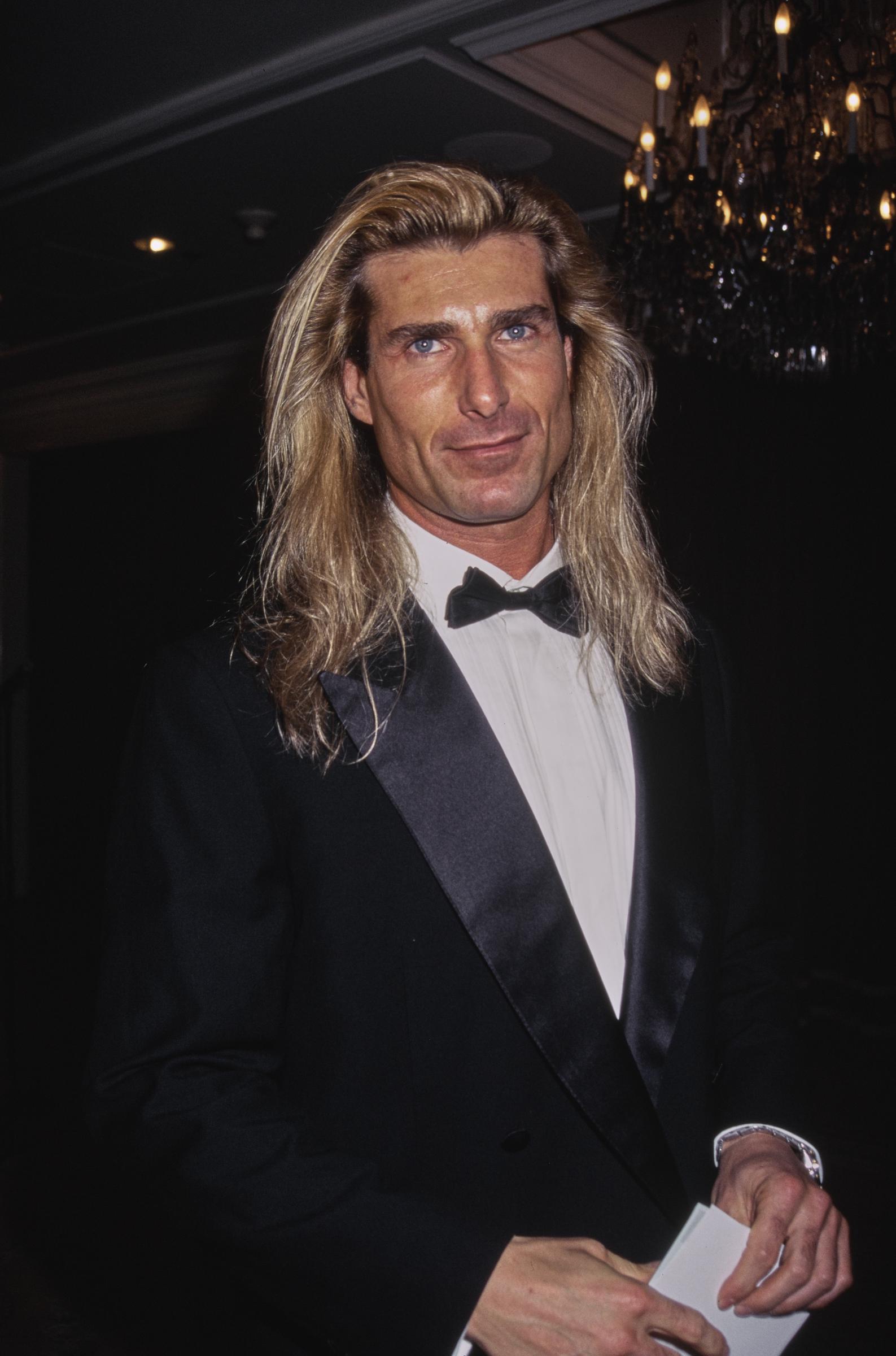 His stunning looks were no accident, as he maintained a remarkably disciplined workout routine. In this photo, he wore a tuxedo and bow tie while attending the 32nd Annual National Association of Television Program Executives Convention and Exhibition at the Sands Expo Center in Las Vegas, Nevada, on January 23, 1995. | Source: Getty Images