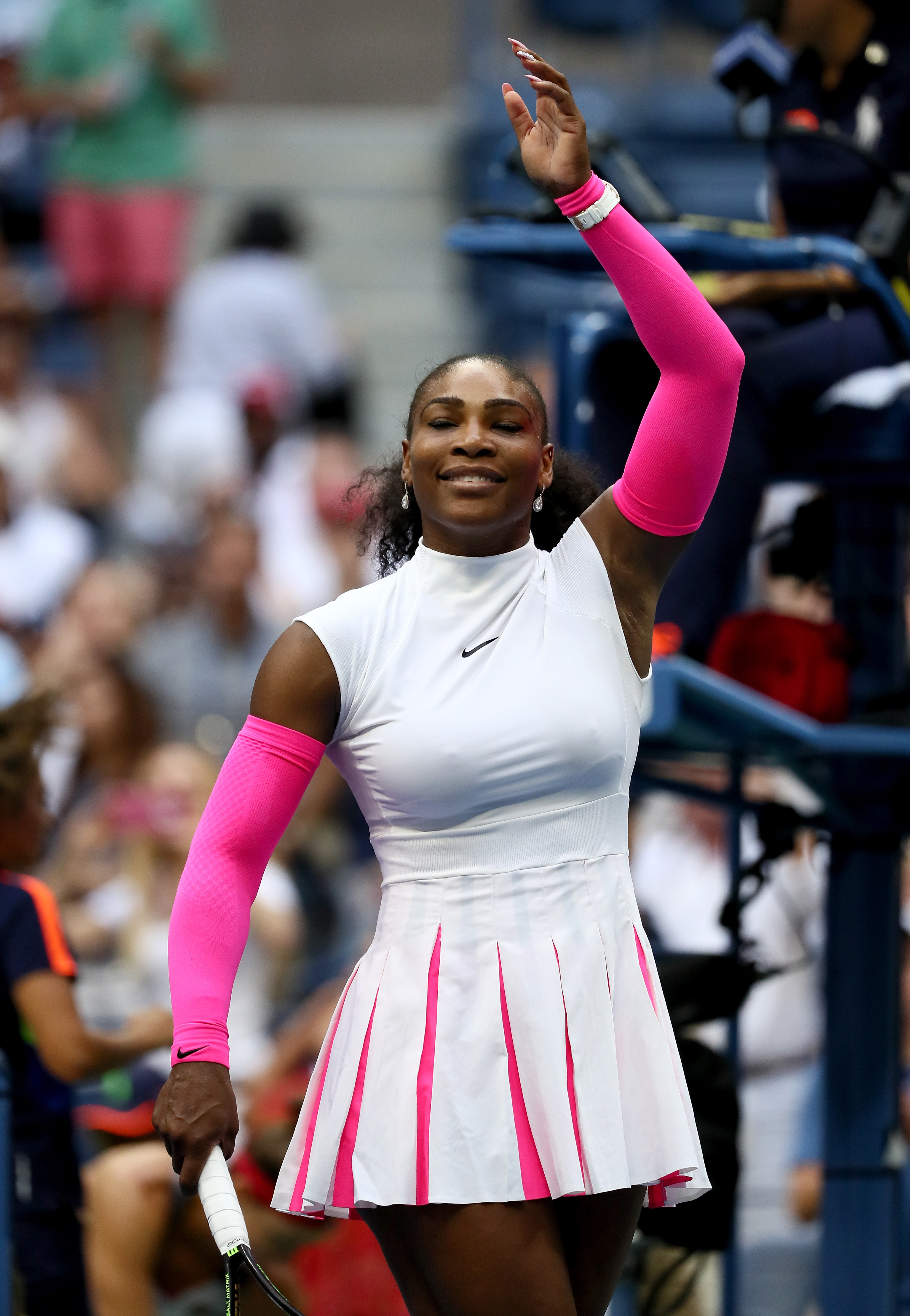 Serena Williams struck her signature celebratory pose, hands raised and a smile lighting up her face after defeating Yaroslava Shvedova. The victory came during their fourth-round Women’s Singles match on Day Eight of the US Open at the USTA Billie Jean King National Tennis Center in Queens, New York City.