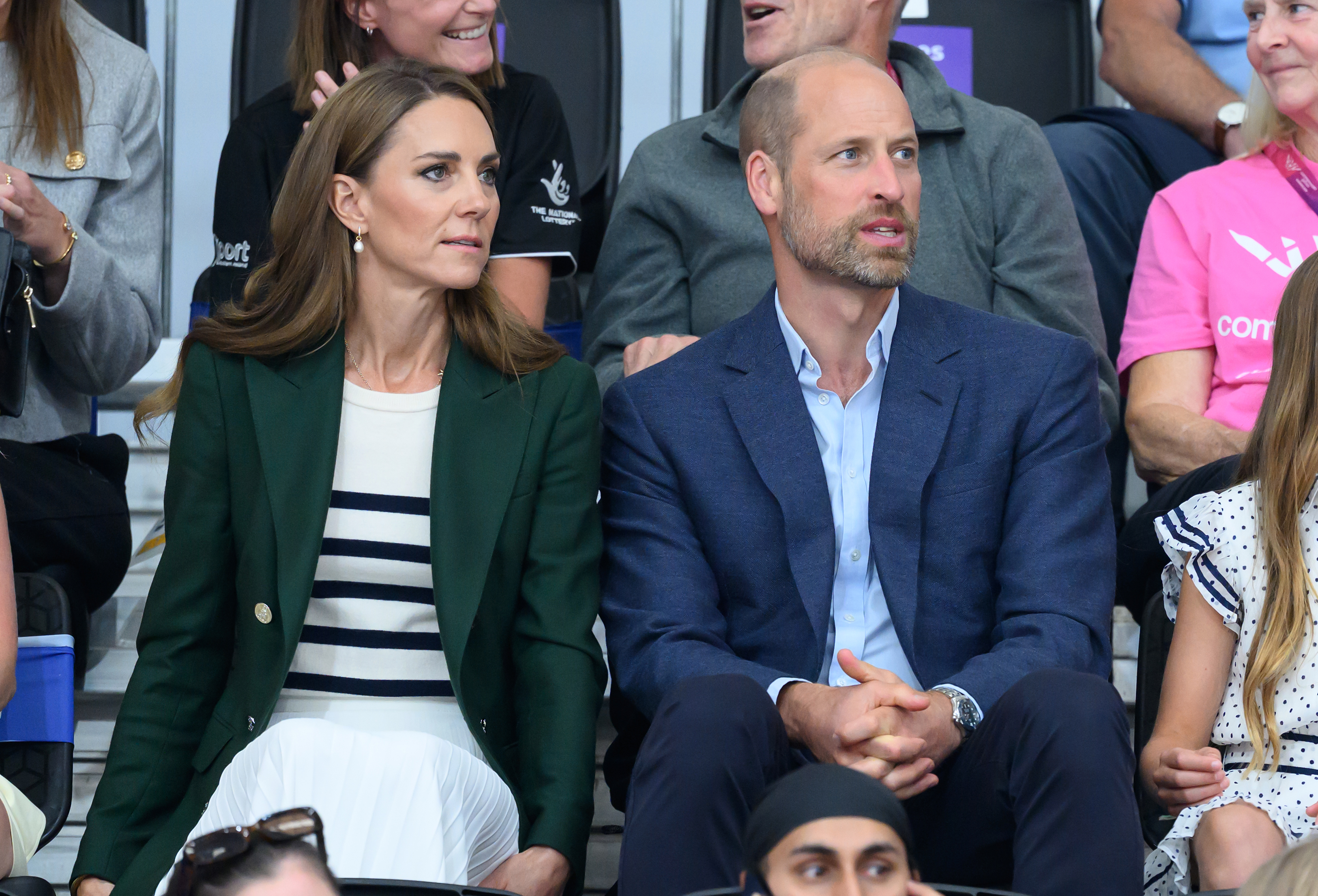 Prince William and Catherine, Princess of Wales, share a moment during a public appearance, reflecting the partnership at the heart of their royal lives. According to Christopher Andersen, William has repeatedly stepped in to defend Catherine when he believed she was being treated unfairly, including over an alleged request to change the spelling of her name. | Source: Getty Images