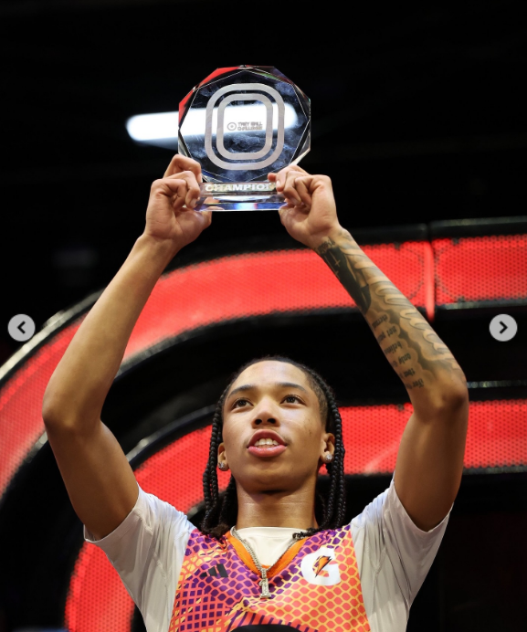 Monica's son, Romelo Hill, holding a basketball championship trophy, from a post dated January 13, 2026 | Source: Instagram/monicadenise