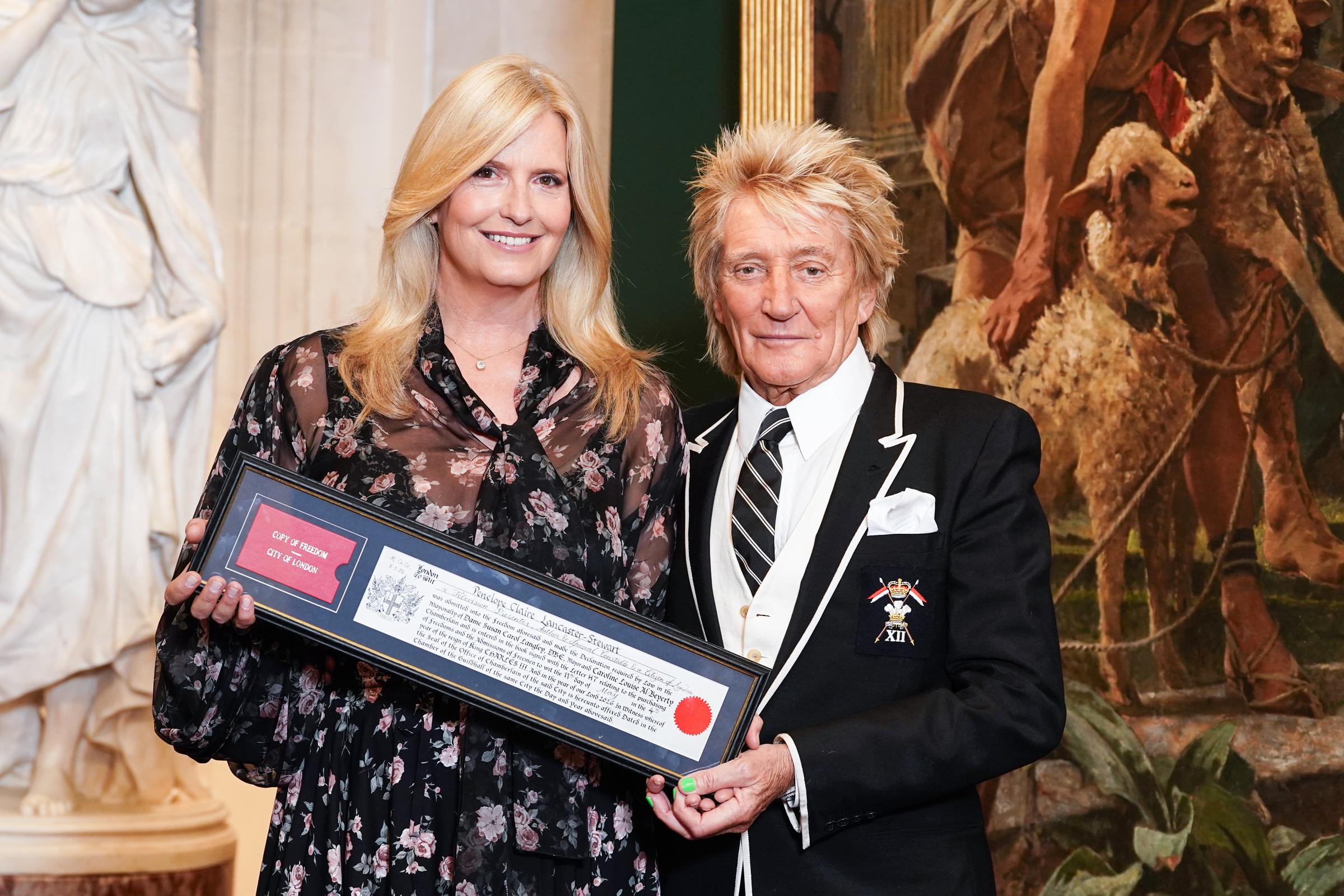 Lady Penny Lancaster poses with her husband Sir Rod Stewart after receiving the Freedom of the City of London at Guildhall in London on May 11, 2026. | Source: Getty Images