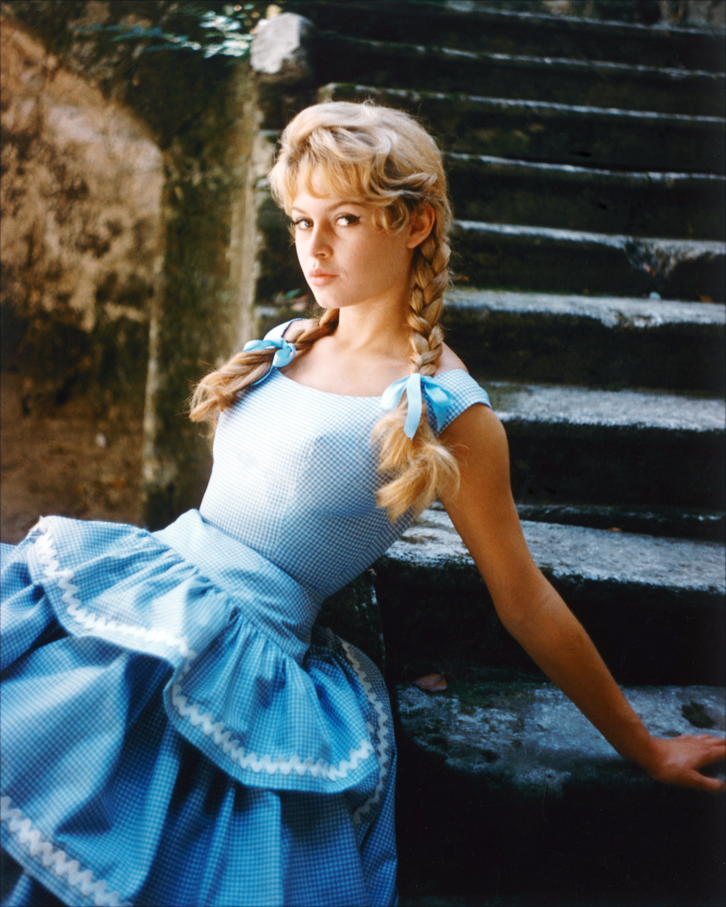 Brigitte Bardot sitting in a series of stone steps in 1960. | Source: Getty Images