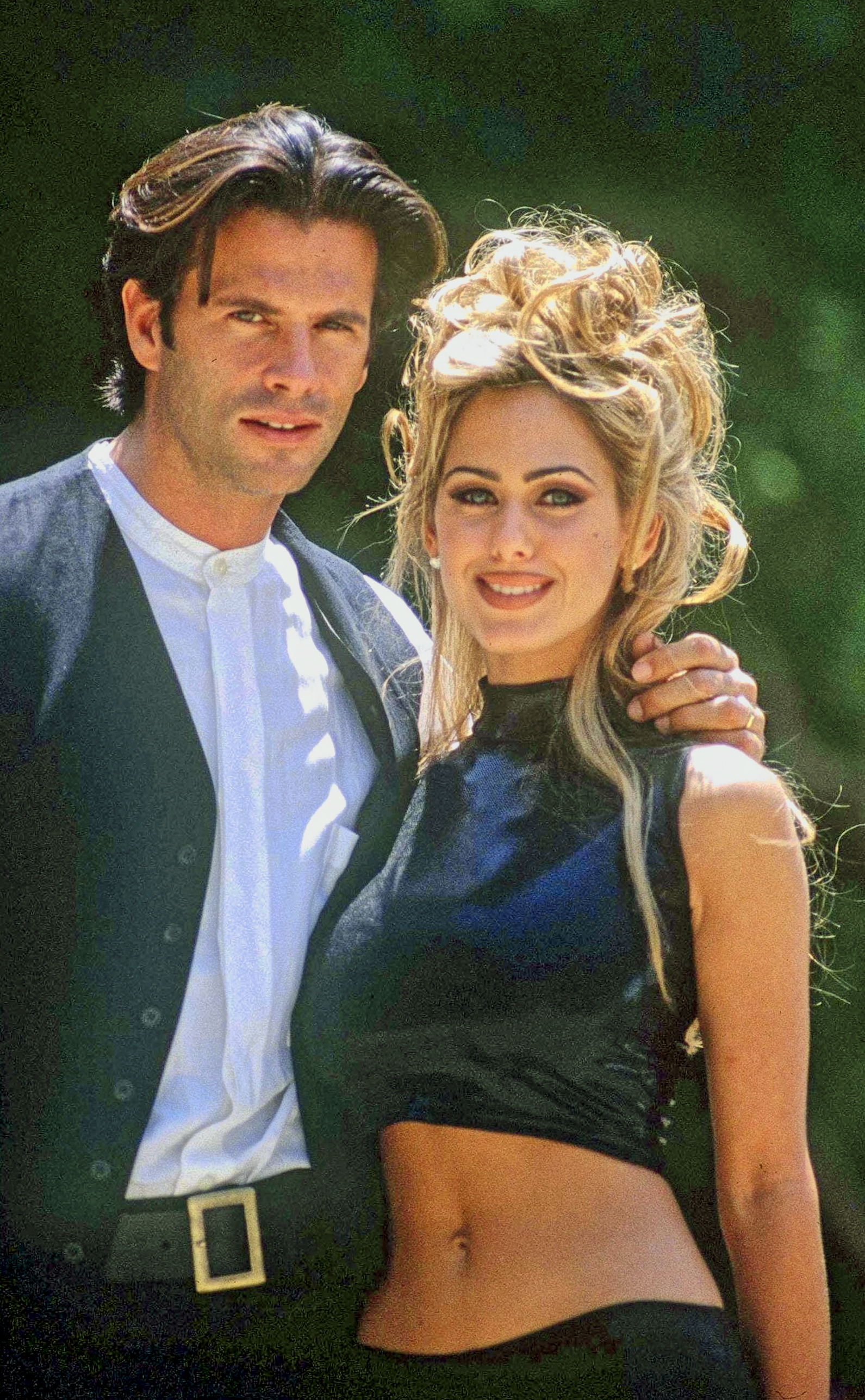 Moving into the 1990s, Lorenzo Lamas appeared alongside Shauna Sand, with the pair posing together for a photograph in the United States. His longer, swept-back hairstyle marked a change from the clean-cut look of the previous decade, while Sand wore her blonde hair in an elaborate updo. Their relationship became another prominent chapter in Lamas's life as his career continued beyond his early heartthrob years.