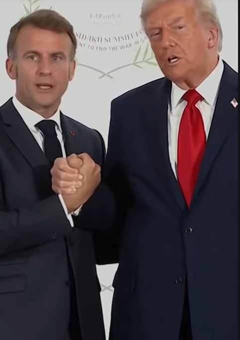 President Donald Trump and French President Emmanuel Macron during their 26-second long handshake at the summit in Egypt, from a video post dated October 13, 2025 | Source: TikTok/reuters