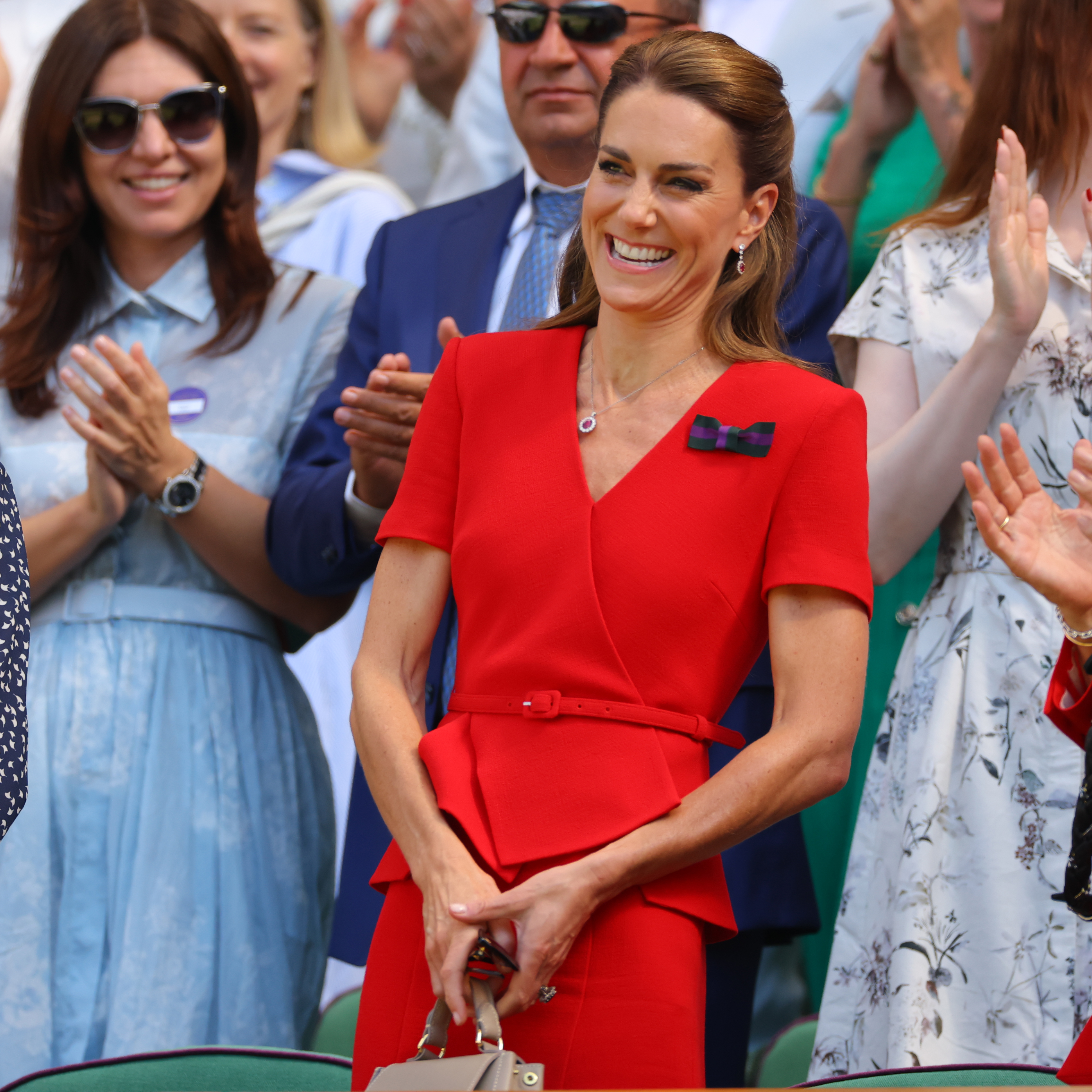 Catherine's second Wimbledon appearance drew attention because she switched from a tailored suit to a bold red dress. The brighter color made this look feel completely different from her opening-day outfit. | Source: Getty Images