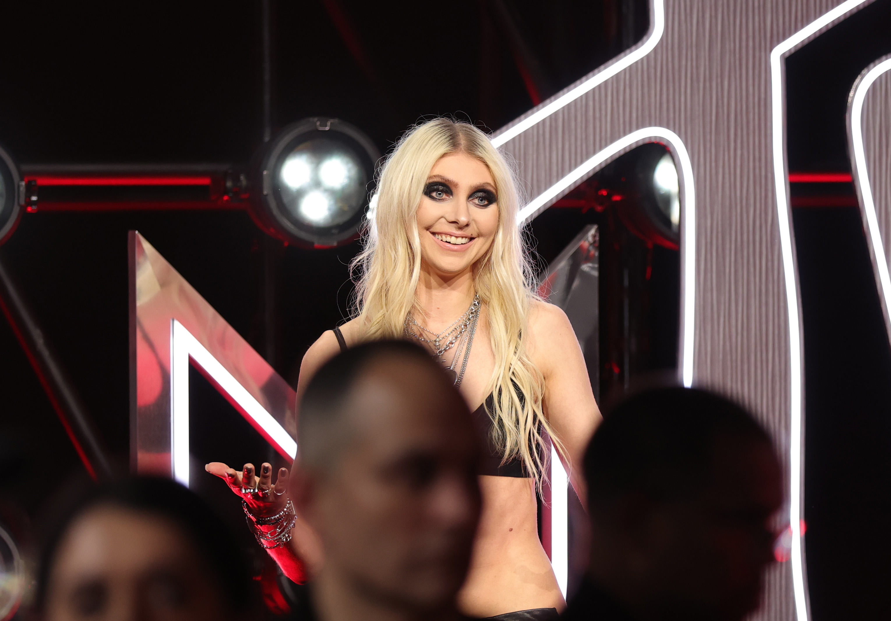 At the MTV Video Music Awards at UBS Arena , Taylor Momsen is photographed flashing a smile while showing off the dark, gothic eye makeup she has maintained all these years.