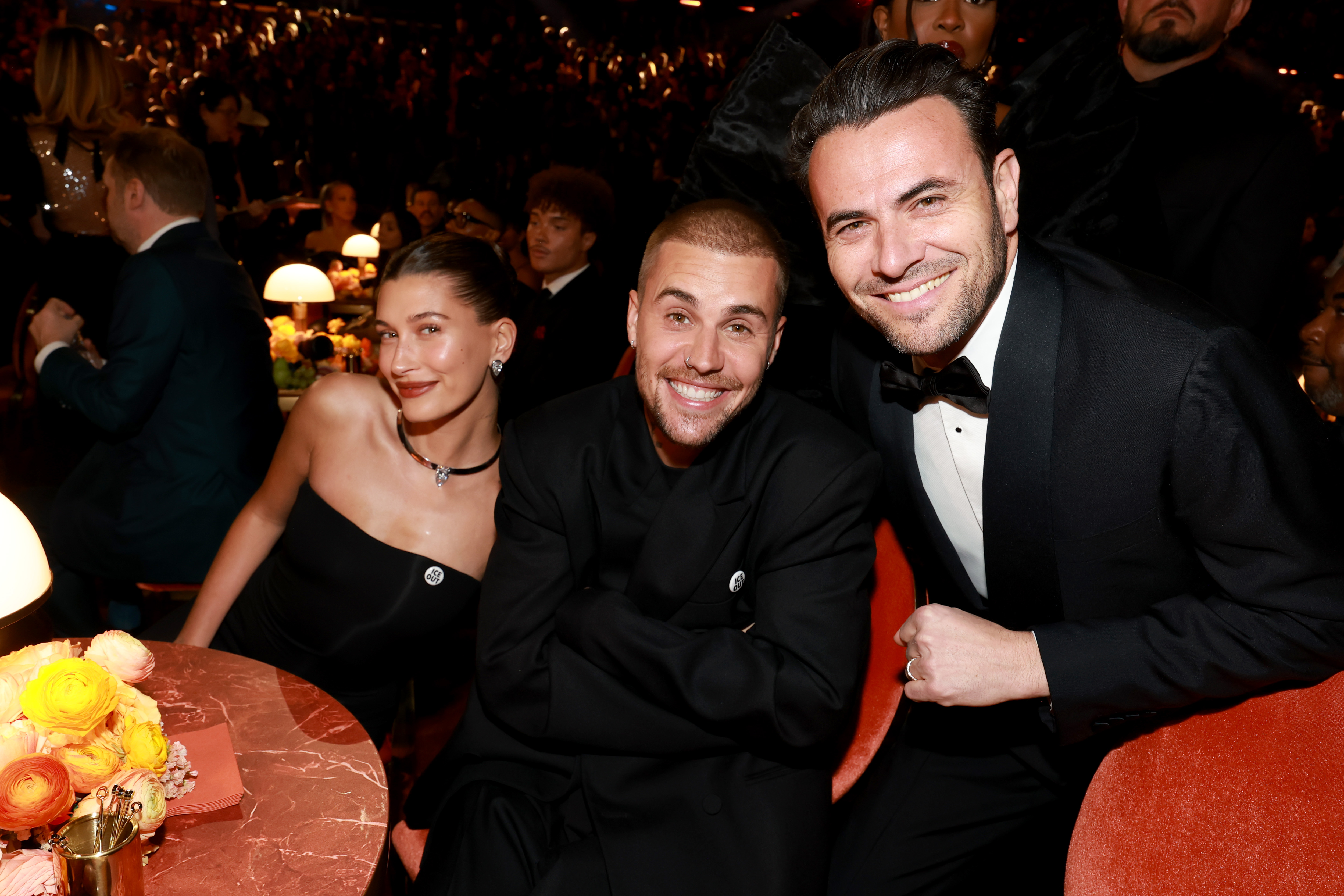 Producer Ben Winston joins Justin and Hailey Bieber at the ceremony.
