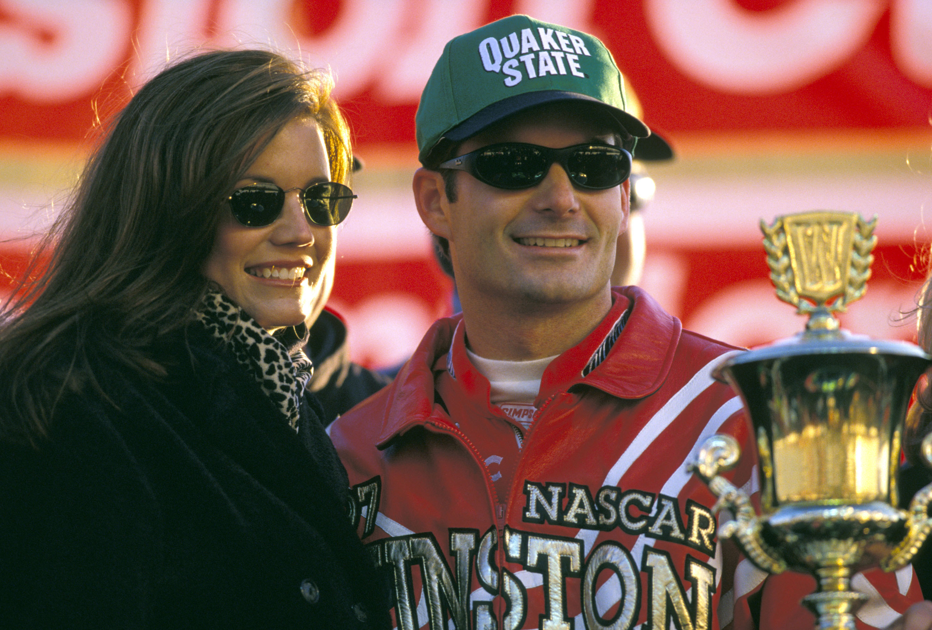 Brooke Sealey joined Jeff Gordon as he celebrated winning the 1997 Winston Cup Championship, standing close to her husband as he posed with a trophy. The title marked another milestone in Gordon's growing NASCAR career, while Sealey was regularly seen alongside him during some of his biggest moments on the track.