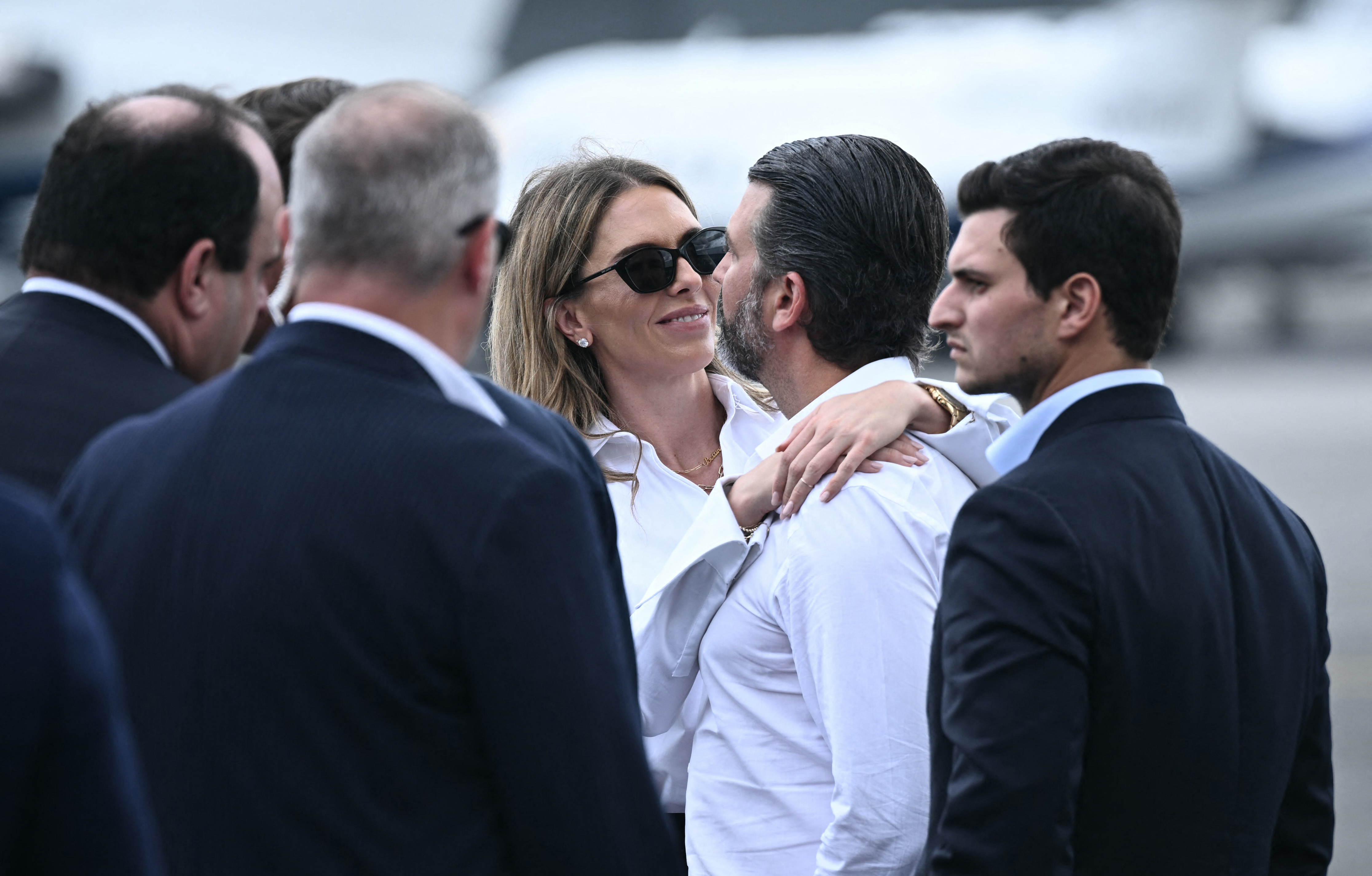 Bettina Anderson hugs Donald Trump Jr. next to Michael Boulos and Boris Epshteyn at Teterboro Airport on July 13, 2025, in Teterboro, New Jersey, ahead of the FIFA Club World Cup final at MetLife Stadium | Source: Getty Images