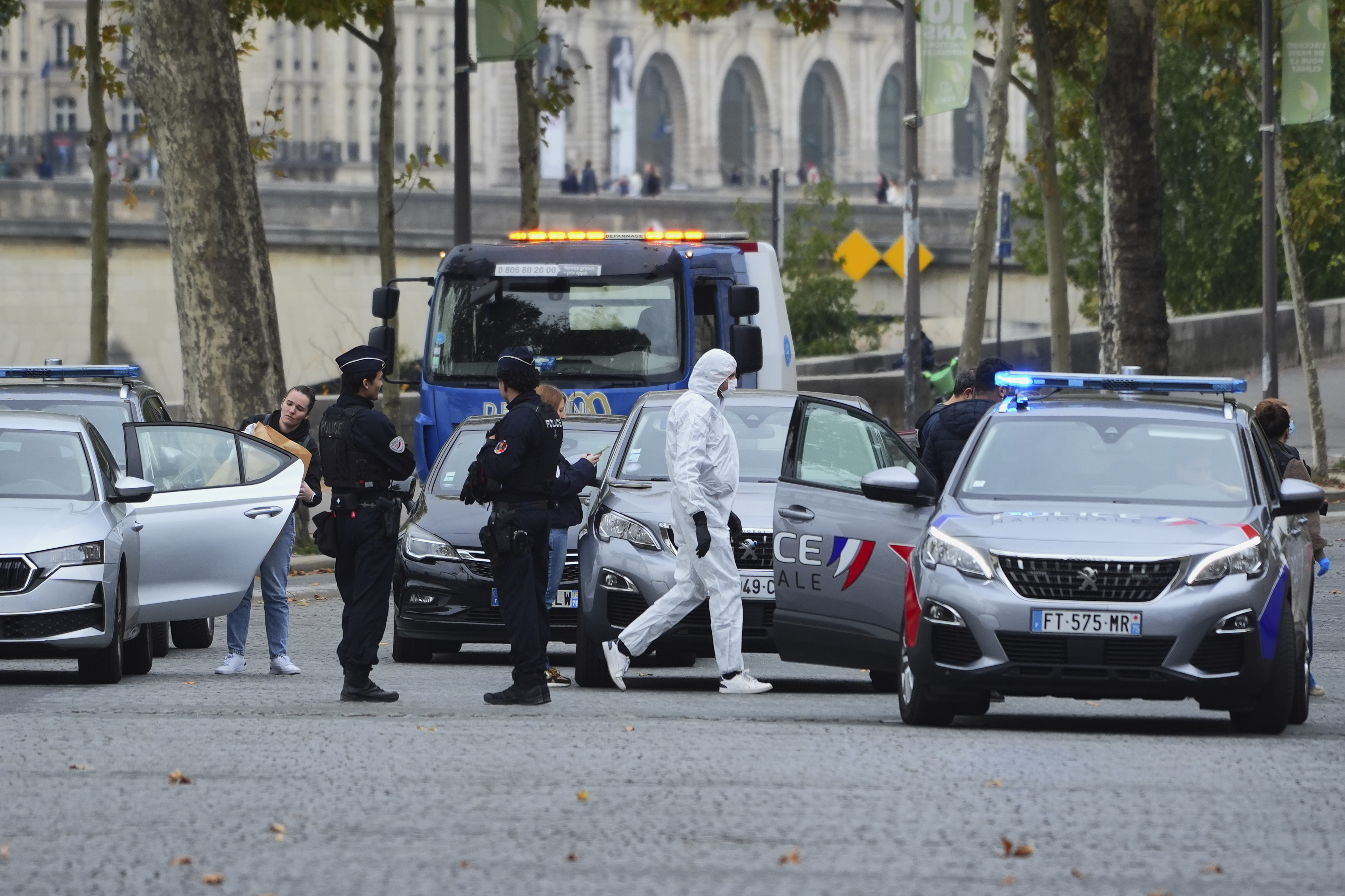 Scientific officers and police near the crime scene at the Louvre on October 19, 2025, in Paris, France. | Source: Getty Images