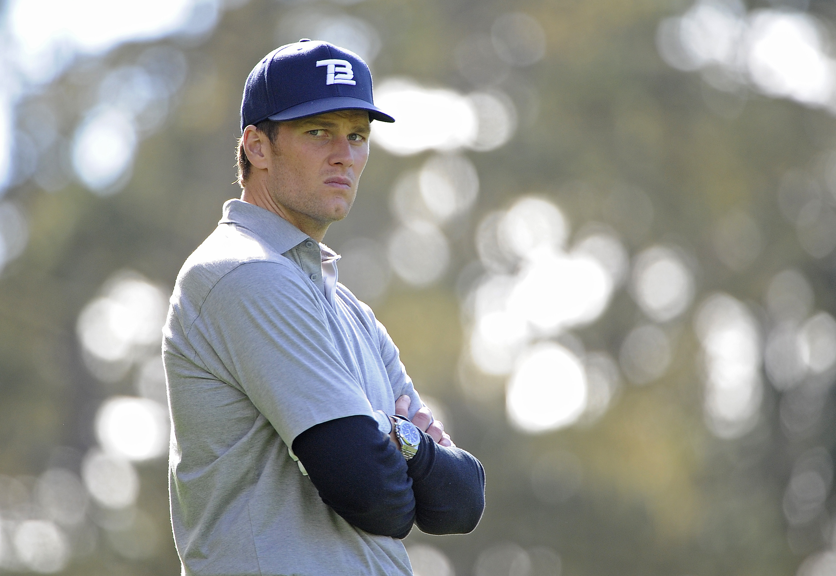 Tom Brady waits to tee off on the 10th hole during the first round of the AT\&T Pebble Beach National Pro-Am at Spyglass Hill Golf Course in California. With a focused, slightly irritated look etched across his face, he channels game-day intensity onto the greens.