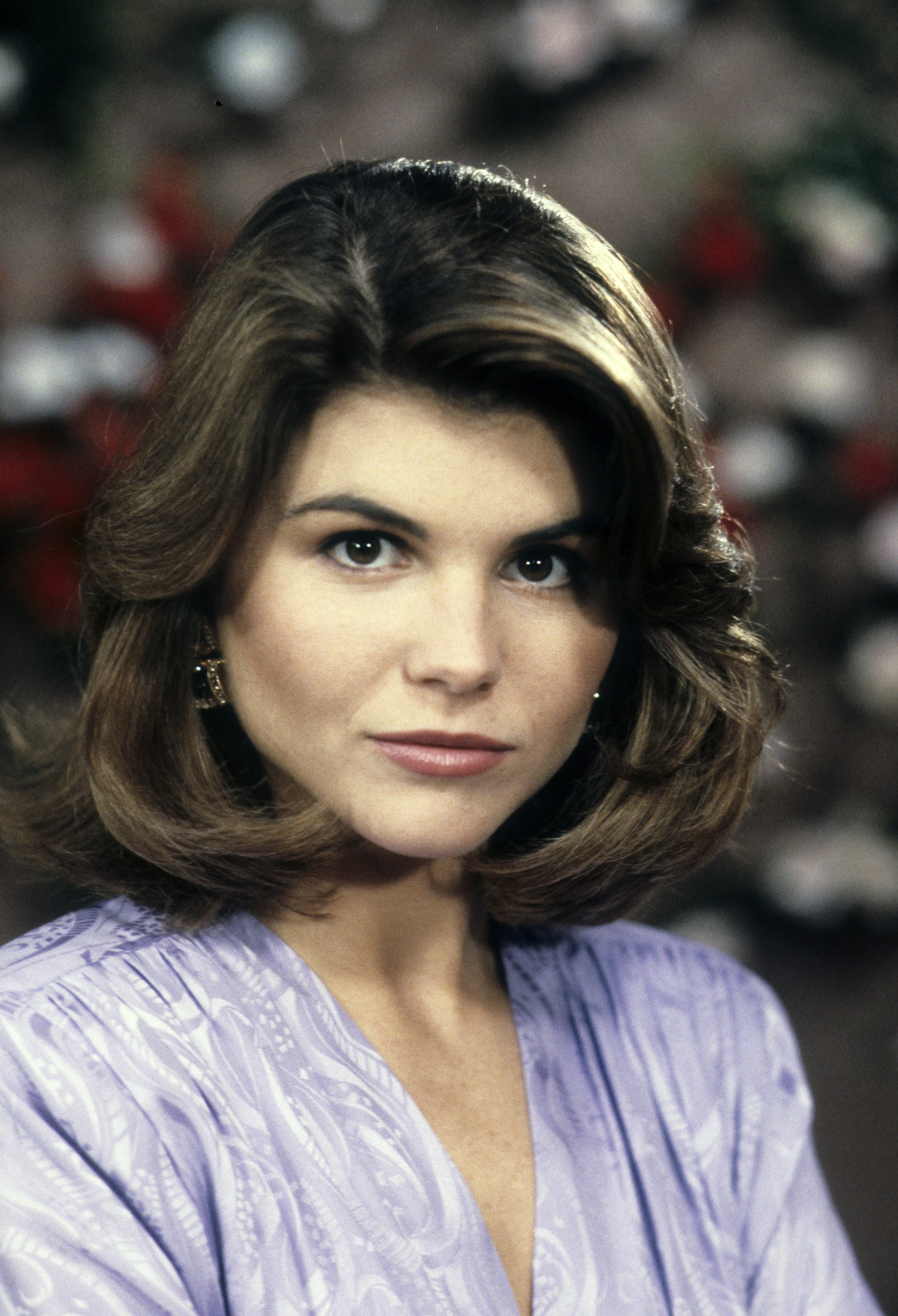 Lori Loughlin delighted fans by making a special return to Instagram years after her memorable television run. For this taping, she posed on the set of "Full House" for the episode "Luck Be A Lady" on April 28, 1989. | Source: Getty Images