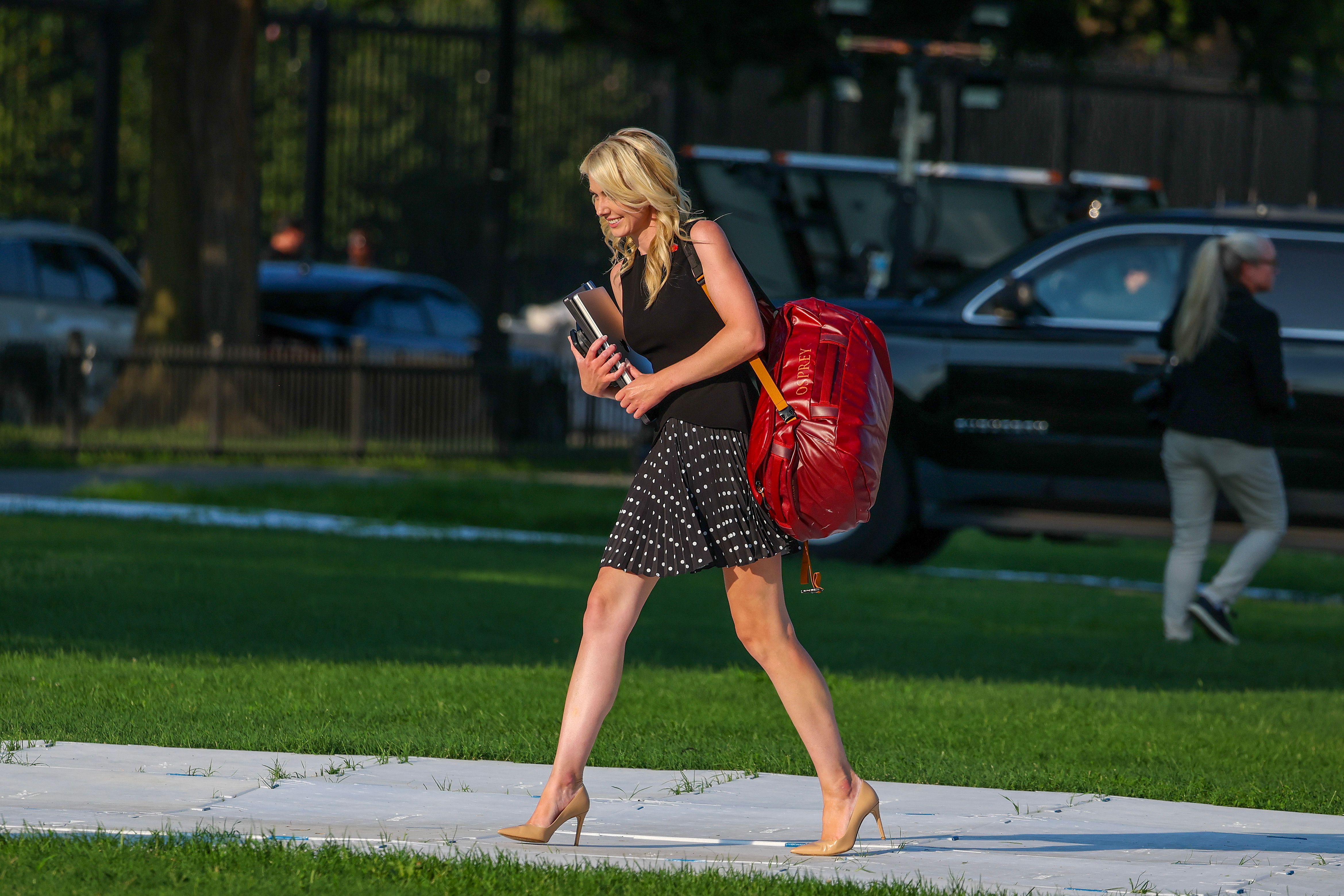 Natalie Harp, an aide to Donald Trump, was photographed arriving at the White House with him after spending the weekend at his Bedminster golf club — another glimpse of the close proximity that has long defined her role in his orbit. | Source: Getty Images