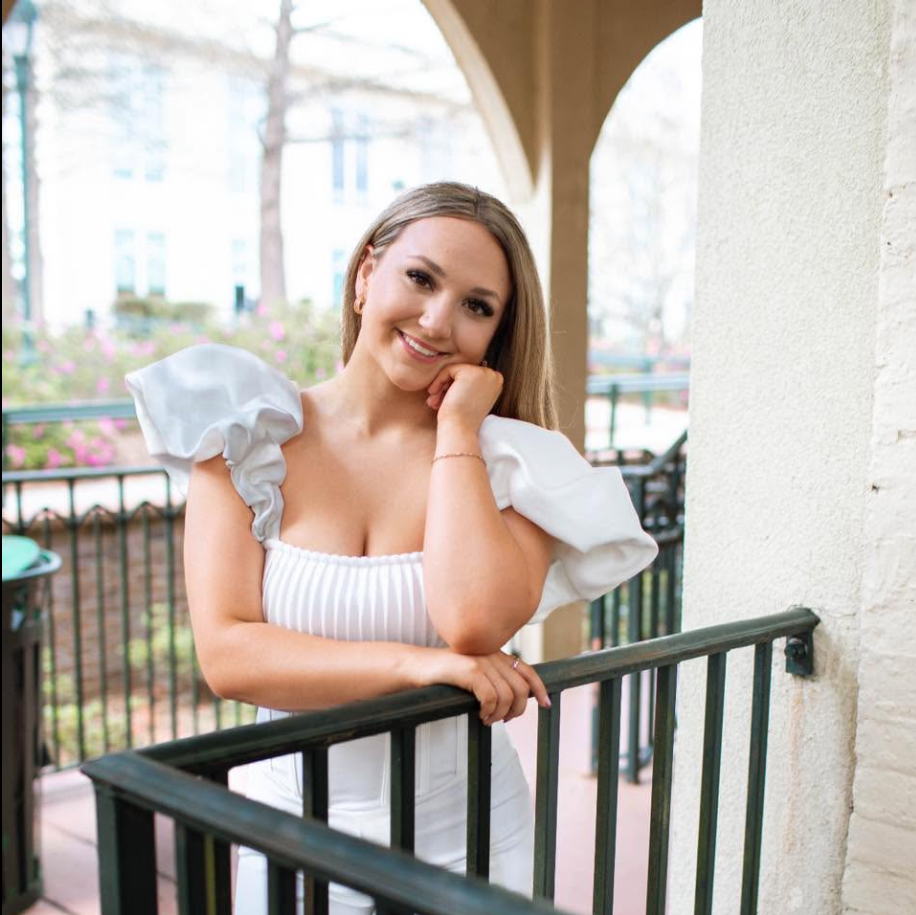 Katie McCormack poses in a white outfit for a polished portrait. Friends have reportedly described her as Nolan Wells’ girlfriend and linked her to his final known conversation. | Source: Facebook/Katie McCormack
