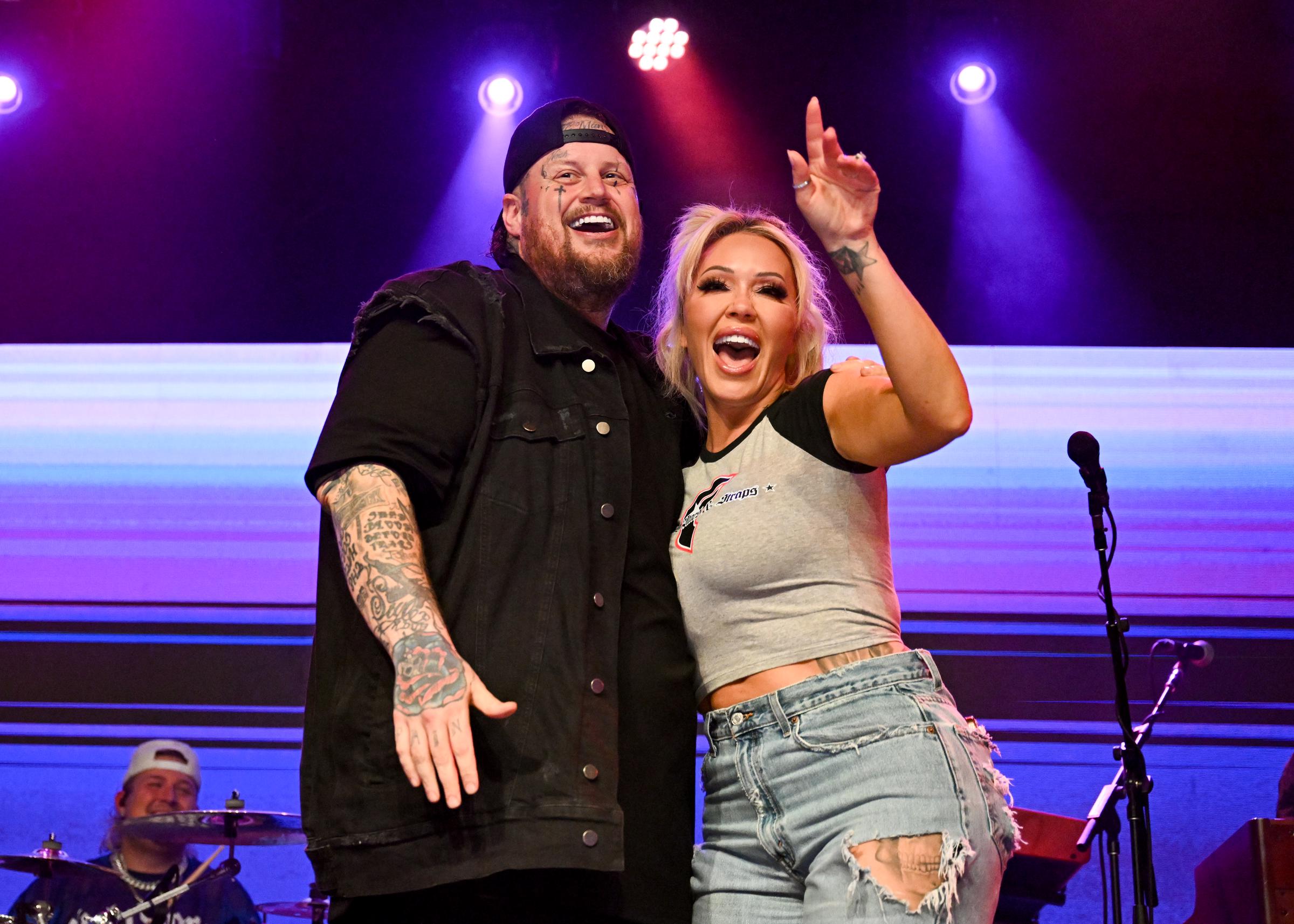Jelly Roll and Bunnie XO share a celebratory moment onstage during a live performance. The couple frequently appeared together at public events and concerts throughout their relationship, which began after they met in 2015 and later married in 2016. | Source: Getty Images