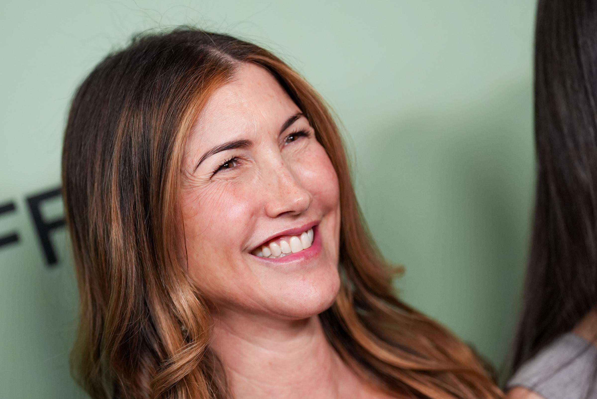 Jackie Sandler, pictured at the "Jay Kelly" premiere in September 2025, has joined her husband and daughters at numerous industry events over the years. | Source: Getty Images