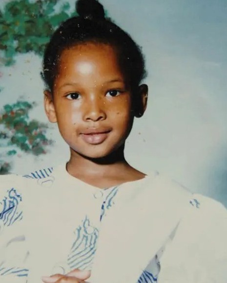The actress smiles in a childhood photo | Source: Youtube/JenniferHudsonShow