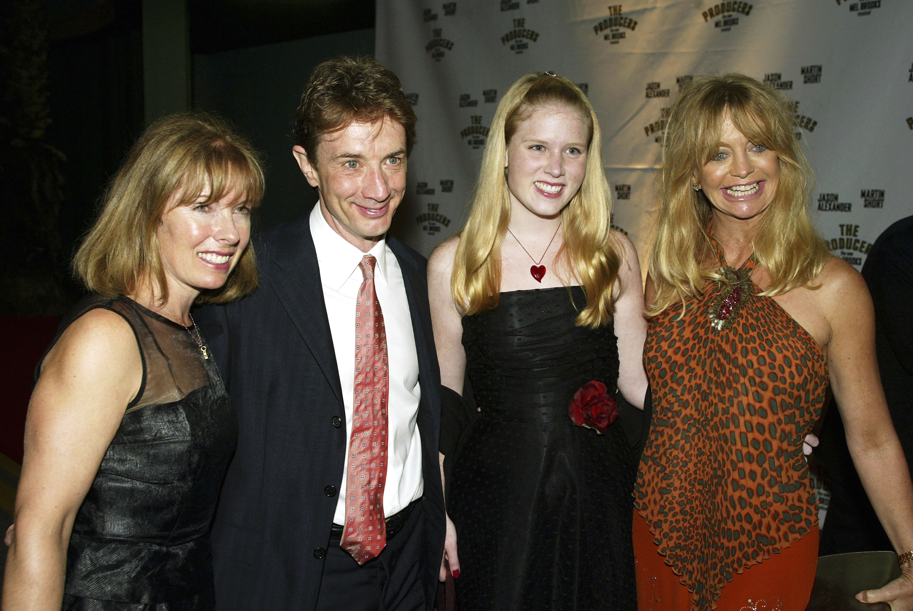 Martin, Nancy, and Katherine Short pose with Goldie Hawn at "The Producers" after party at the Hollywood Palladium on May 29, 2003, in Los Angeles, California | Source: Getty Images