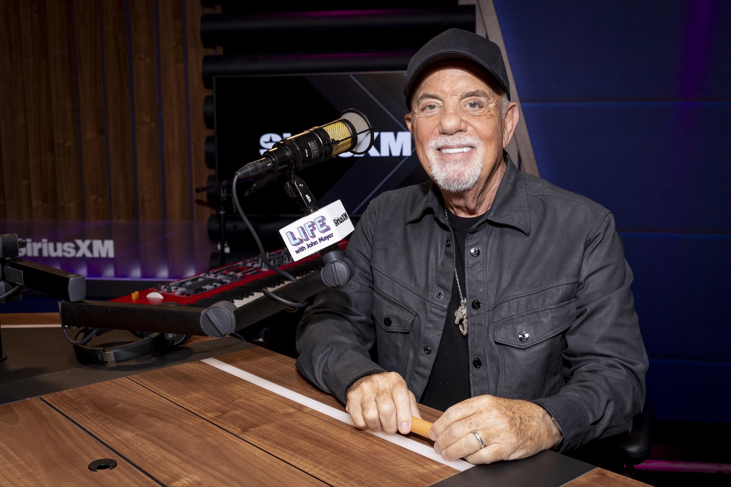 Billy Joel appears on SiriusXM's "How's Life" with John Mayer in Los Angeles on Oct. 11, 2024. Joel recently used his SiriusXM channel to discuss the treatment doctors recommended after his health problems emerged. | Source: Getty Images