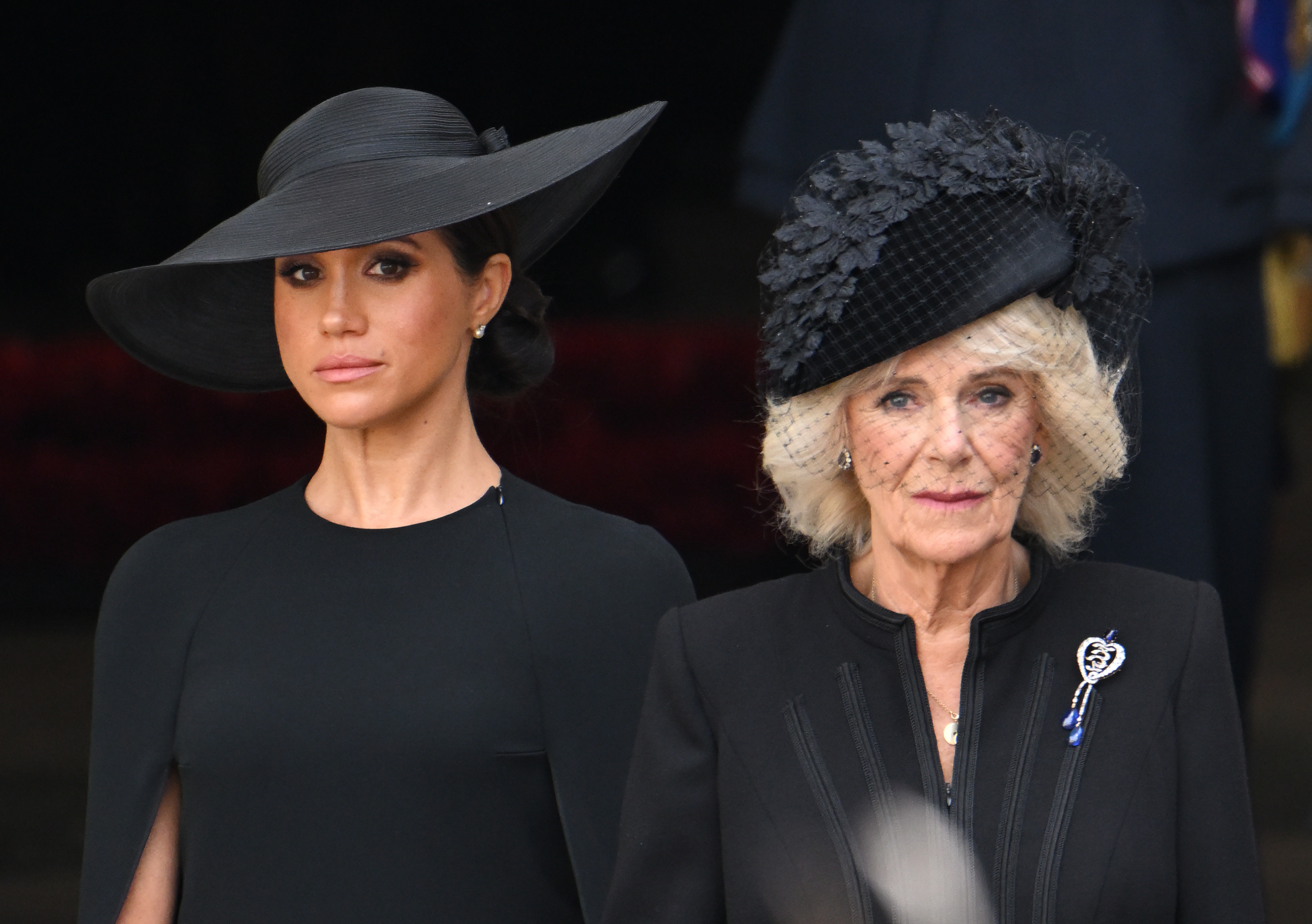 Meghan Markle and Queen Camilla during the state funeral of Queen Elizabeth II at Westminster Abbey on September 19, 2022, in London, England | Source: Getty Images