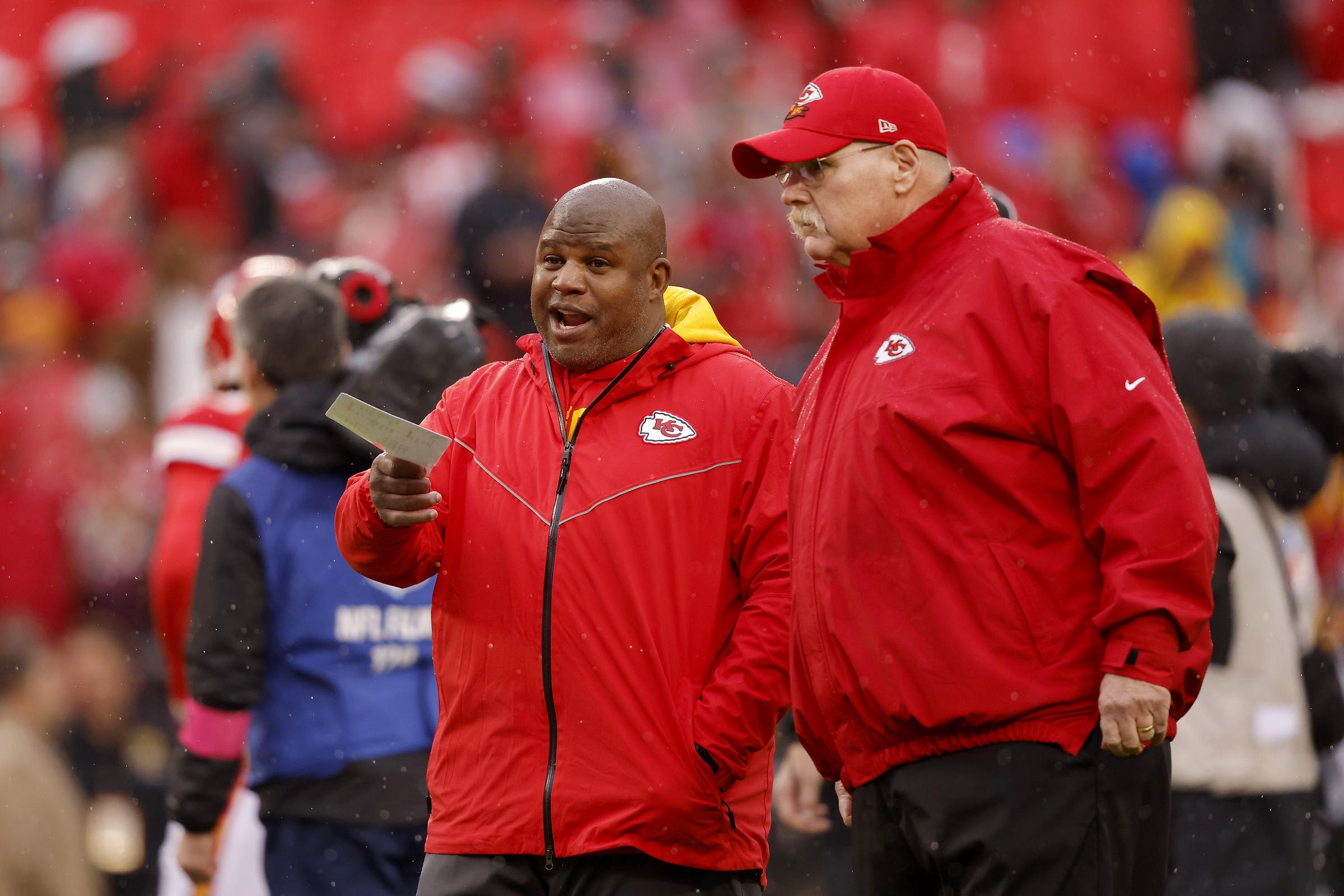 Eric Bieniemy speaks with Chiefs head coach Andy Reid during a 2023 playoff game. Reid said the organization is giving Eric time away from training camp to be with his family following the shooting at his Virginia home. | Source: Getty Images