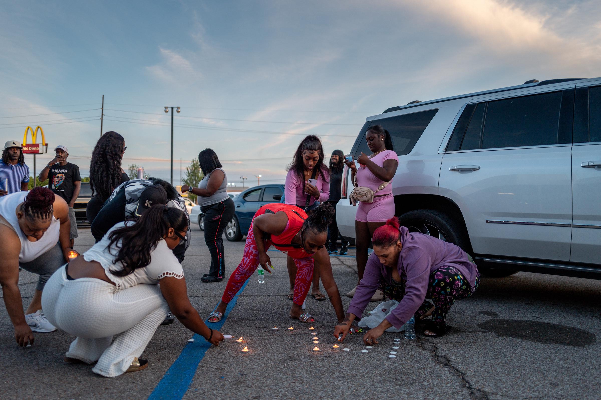 People attend a candlelight vigil in Shreveport, Louisiana on April 19, 2026. | Source: Getty Images