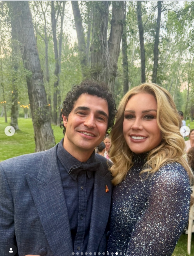 In another candid moment, Heather posed with one of the wedding guests against the backdrop of the trees and reception area. The photo adds to the collection of behind-the-scenes glimpses from Tallulah and Justin’s celebration. | Source: Instagram/heather_parry