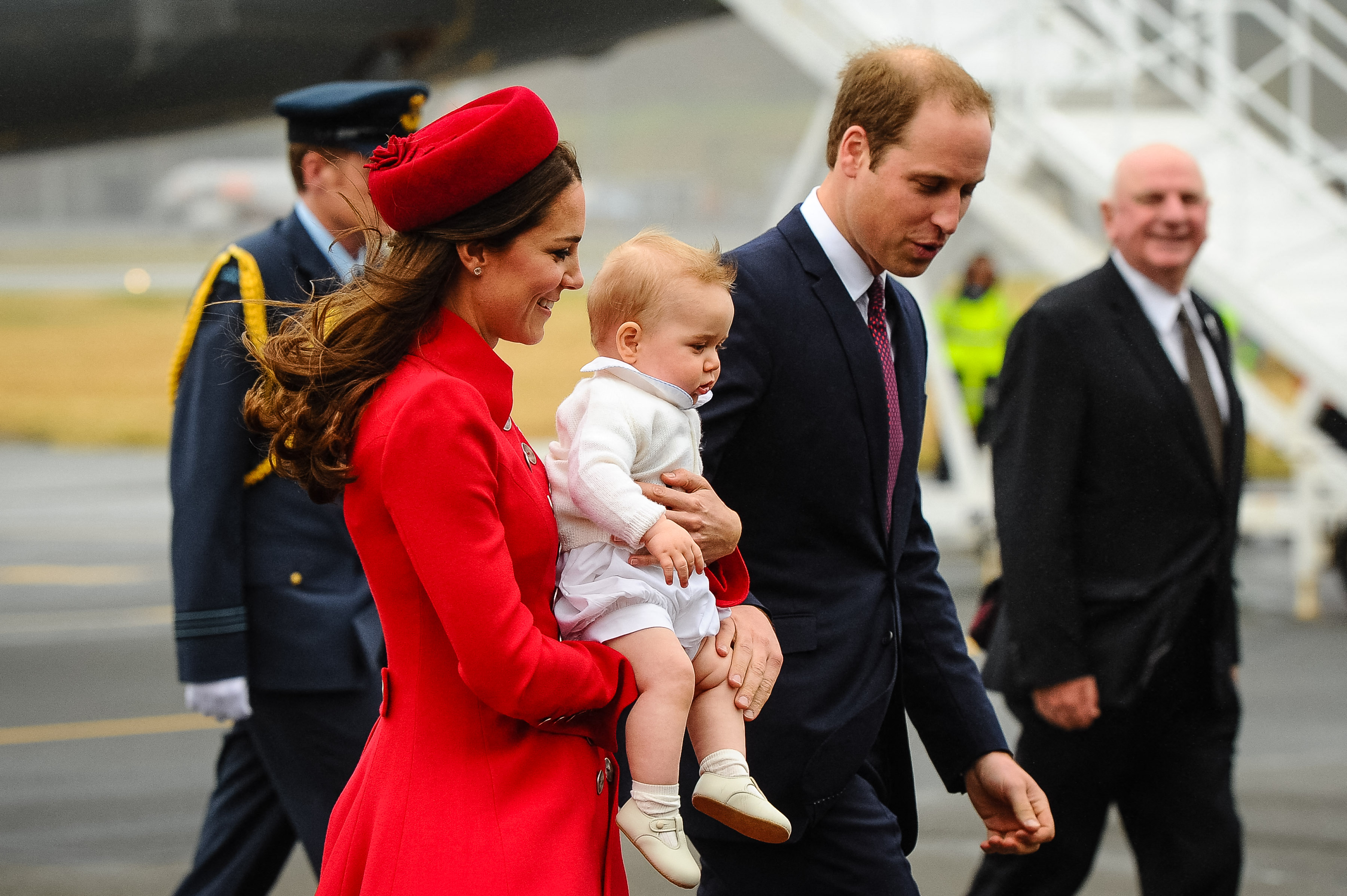 Princess Catherine carries baby George as she arrives in New Zealand with Prince William in April 2014. The family traveled together on a three-week royal tour of New Zealand and Australia, one of George's earliest overseas appearances. | Source: Getty Images
